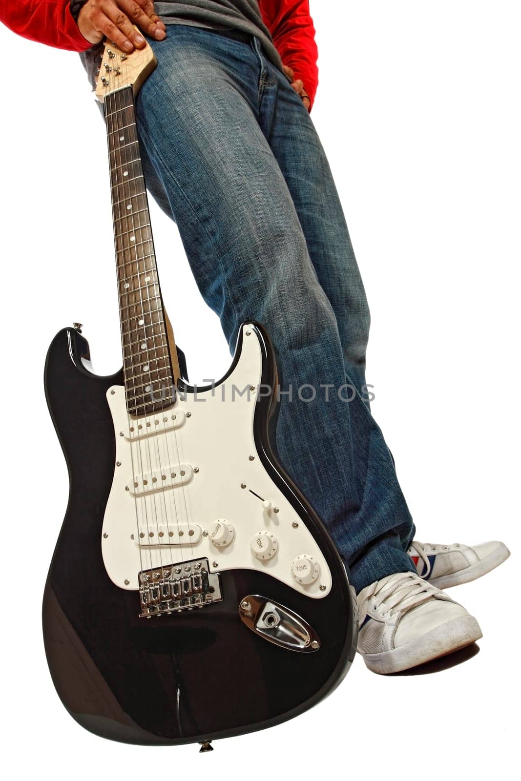 fine detail of rocker with his black guitar