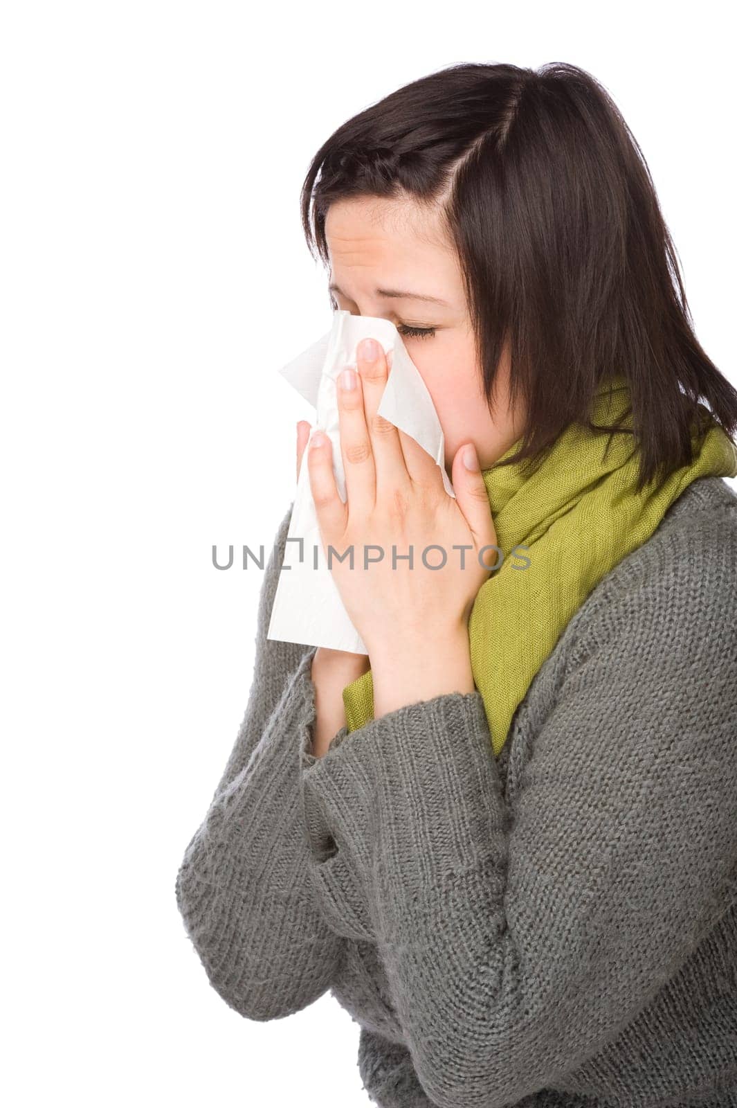 Woman blowing her nose