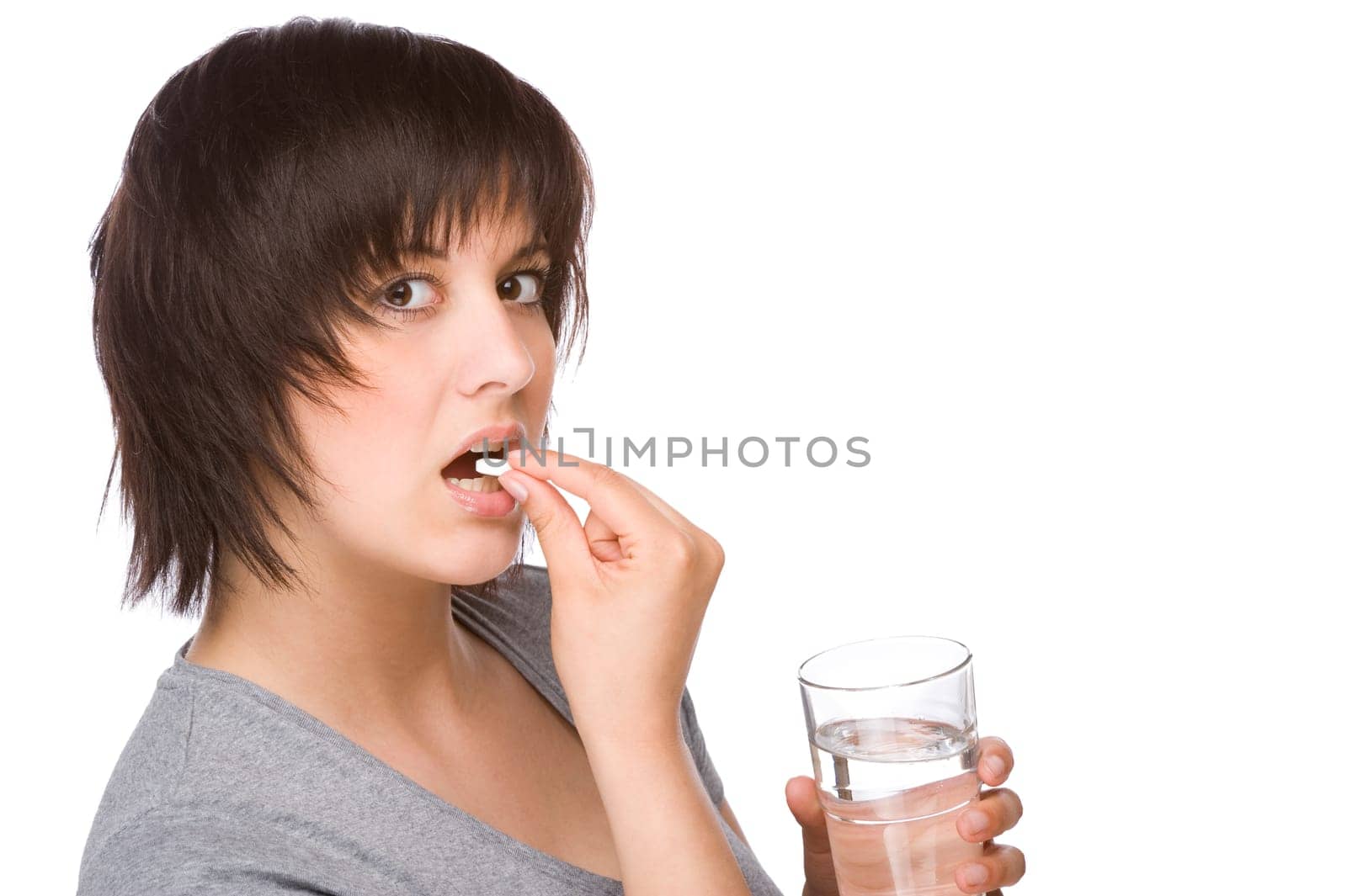 Young women taking a tablet
