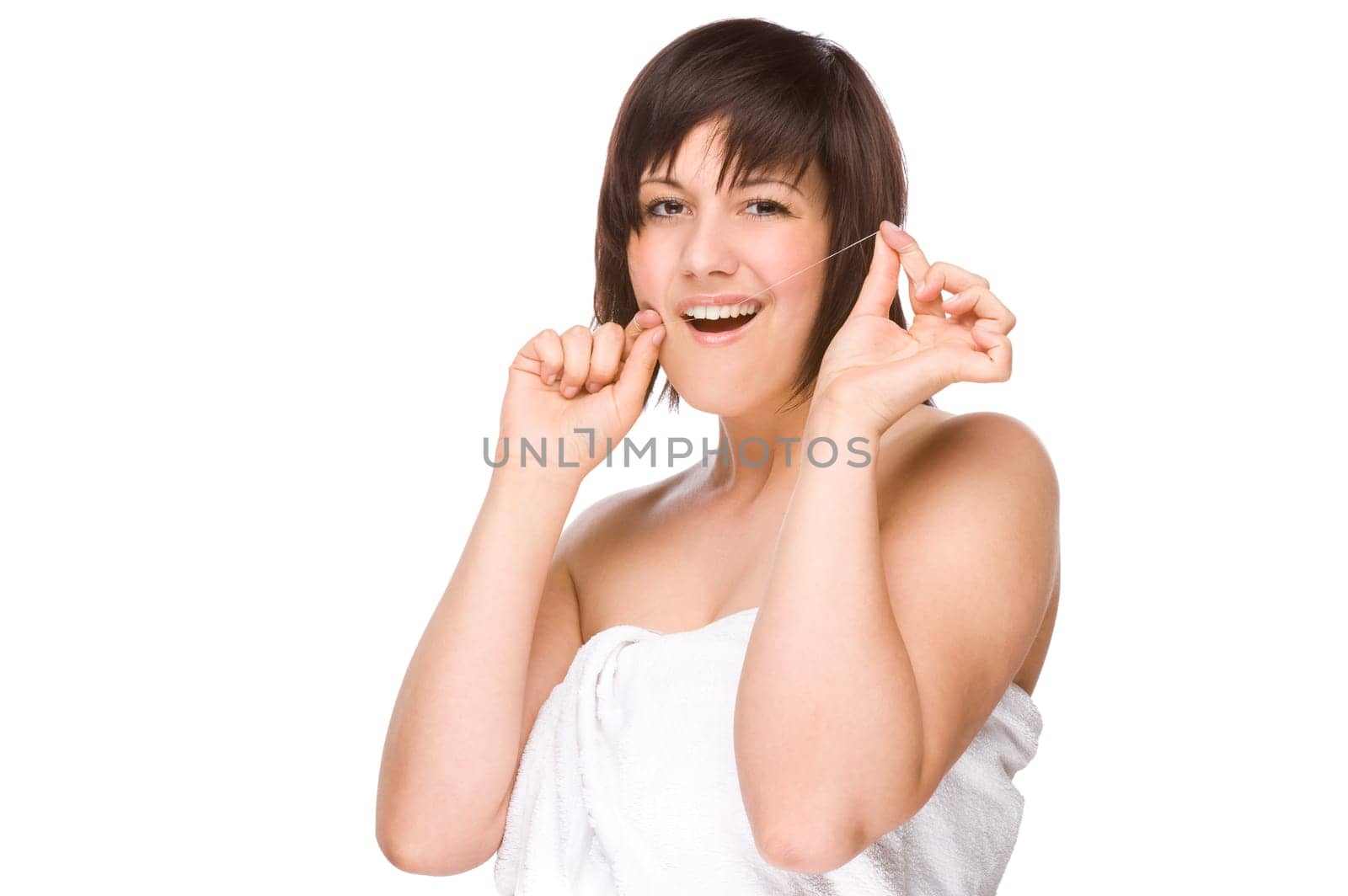 Young woman using dental floss