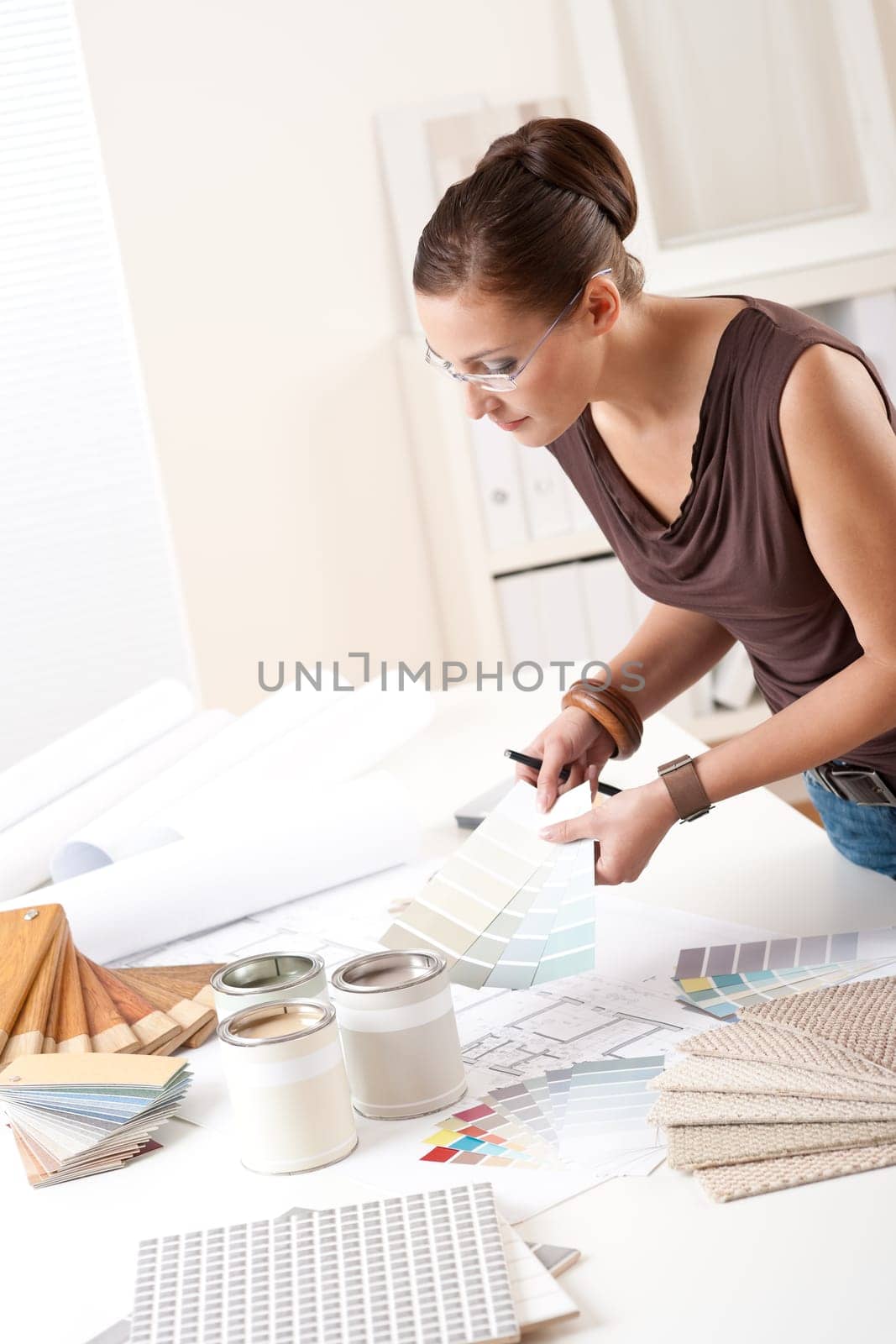 Young female interior designer at office