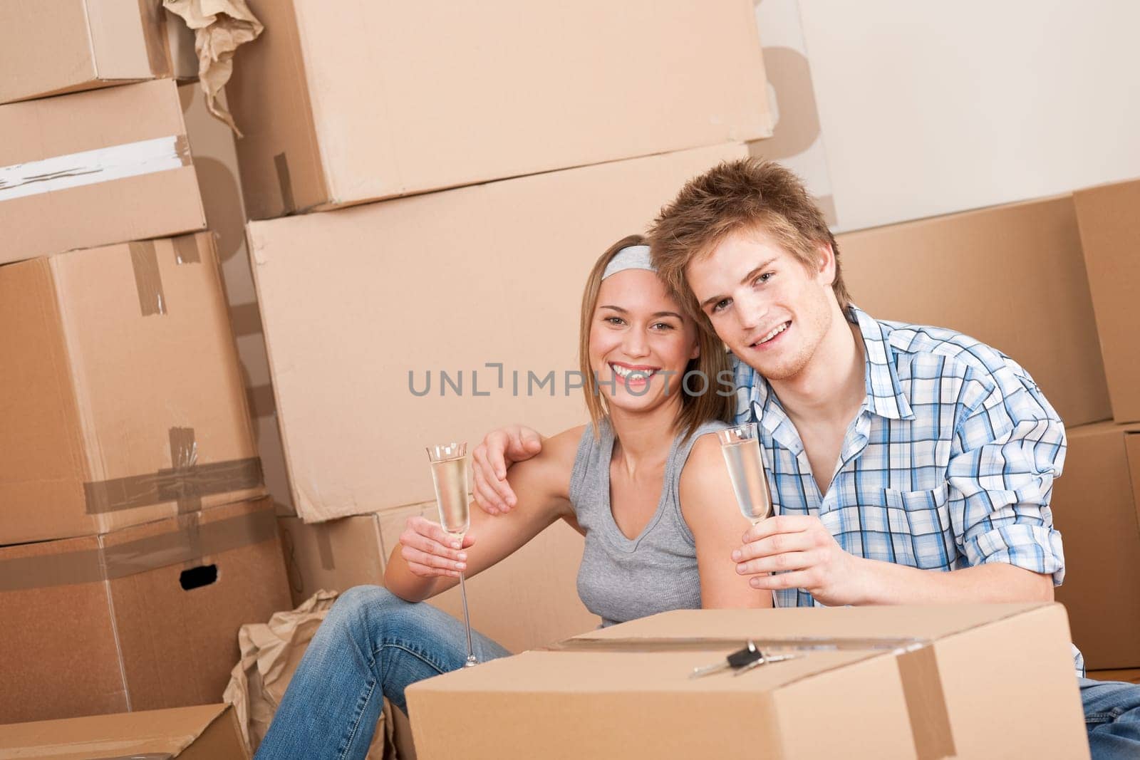 Moving house Couple unpacking box