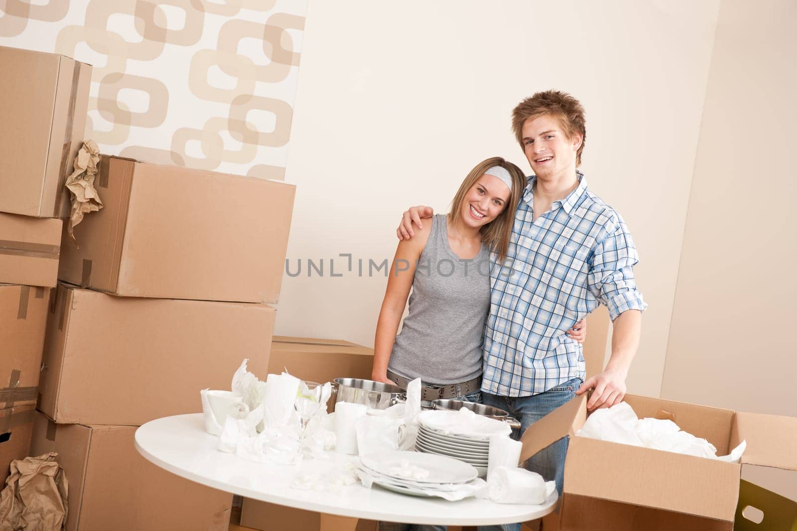 Moving house Couple unpacking box