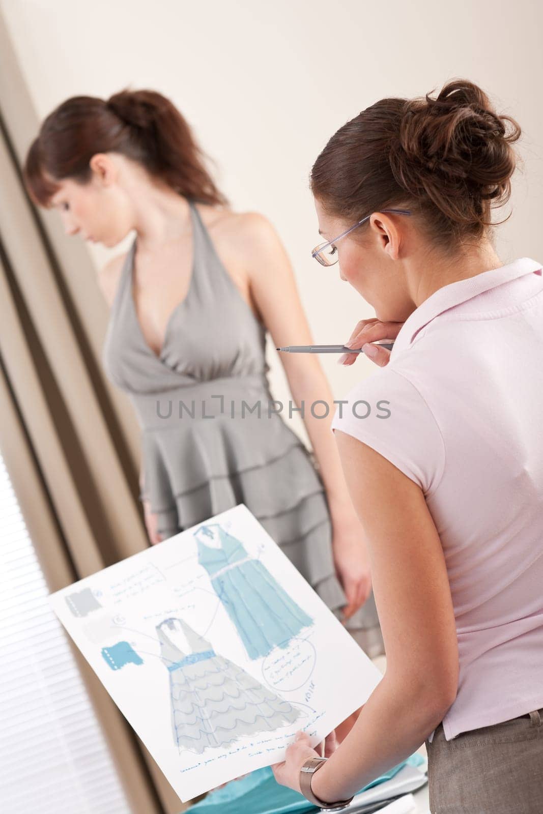 Female fashion designer working at studio