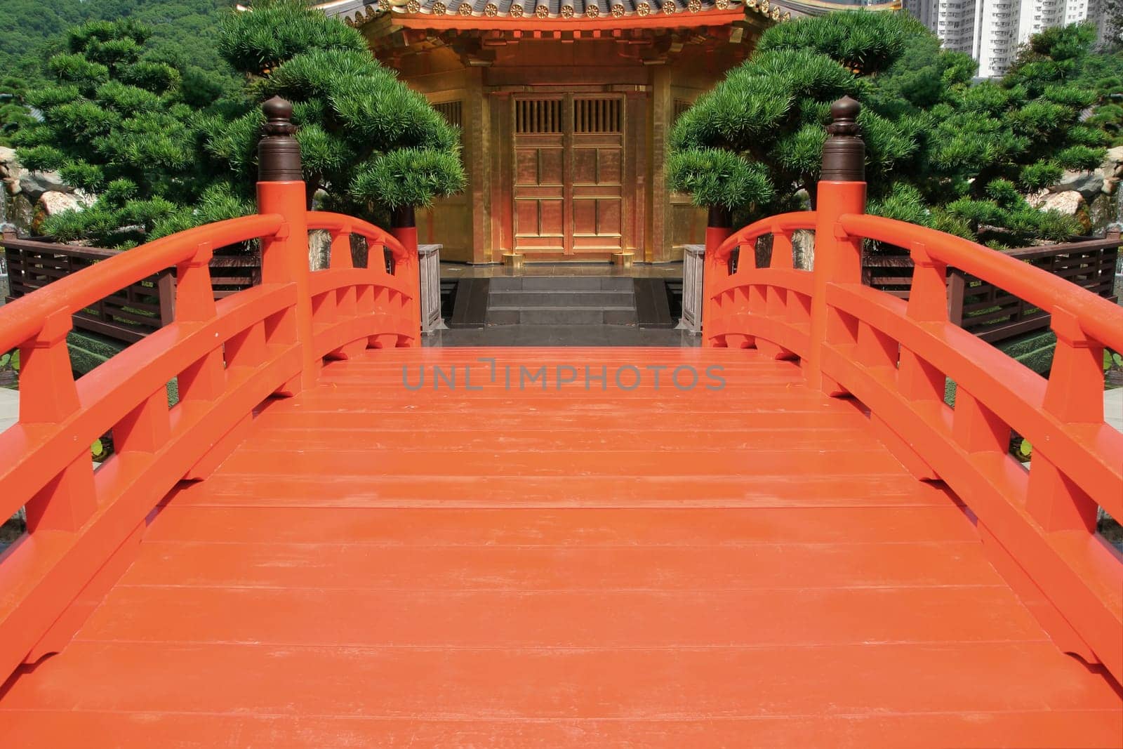 Red bridge in a Chinese garden
