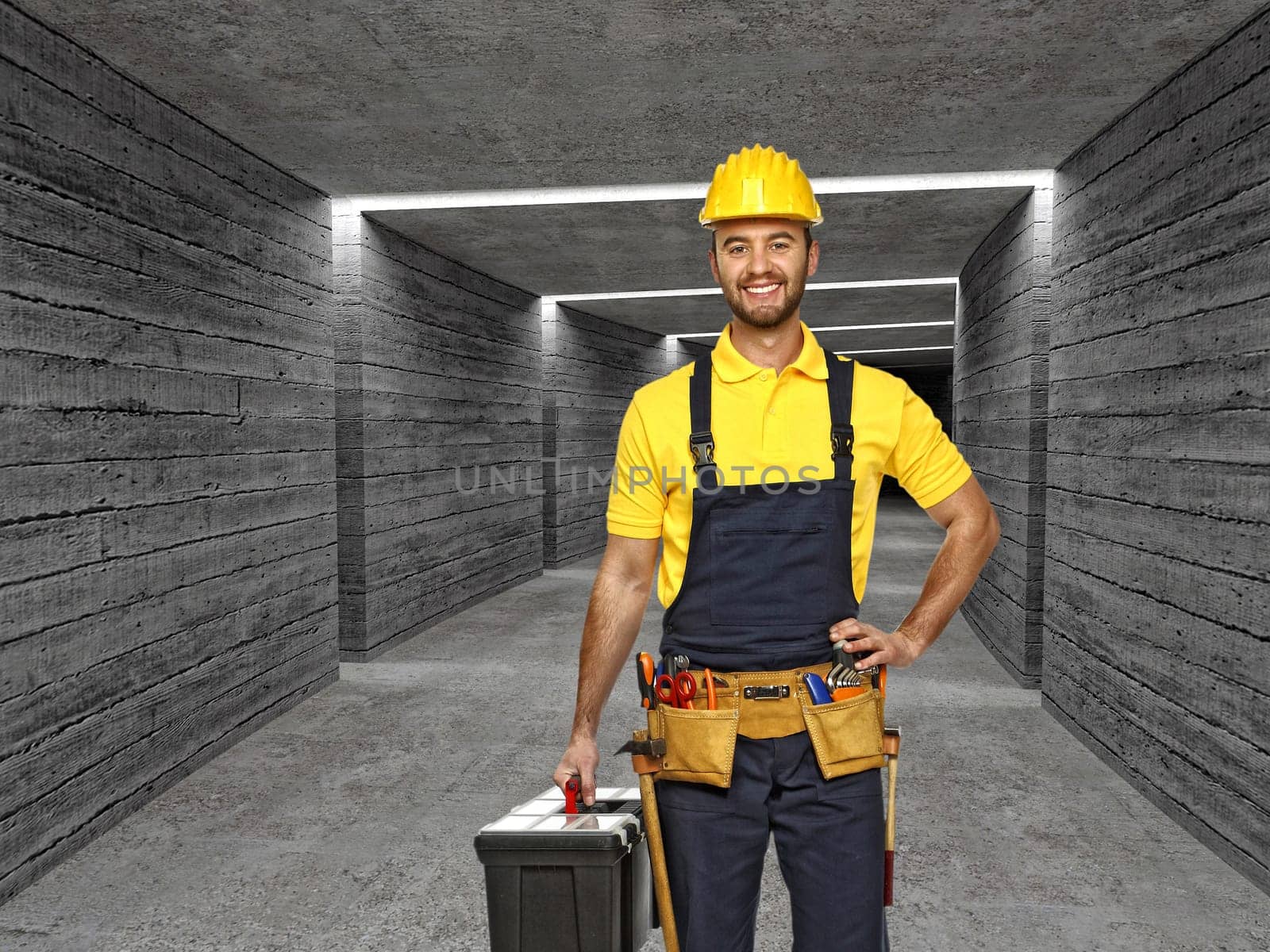 manual worker in concrete tunnel backgro