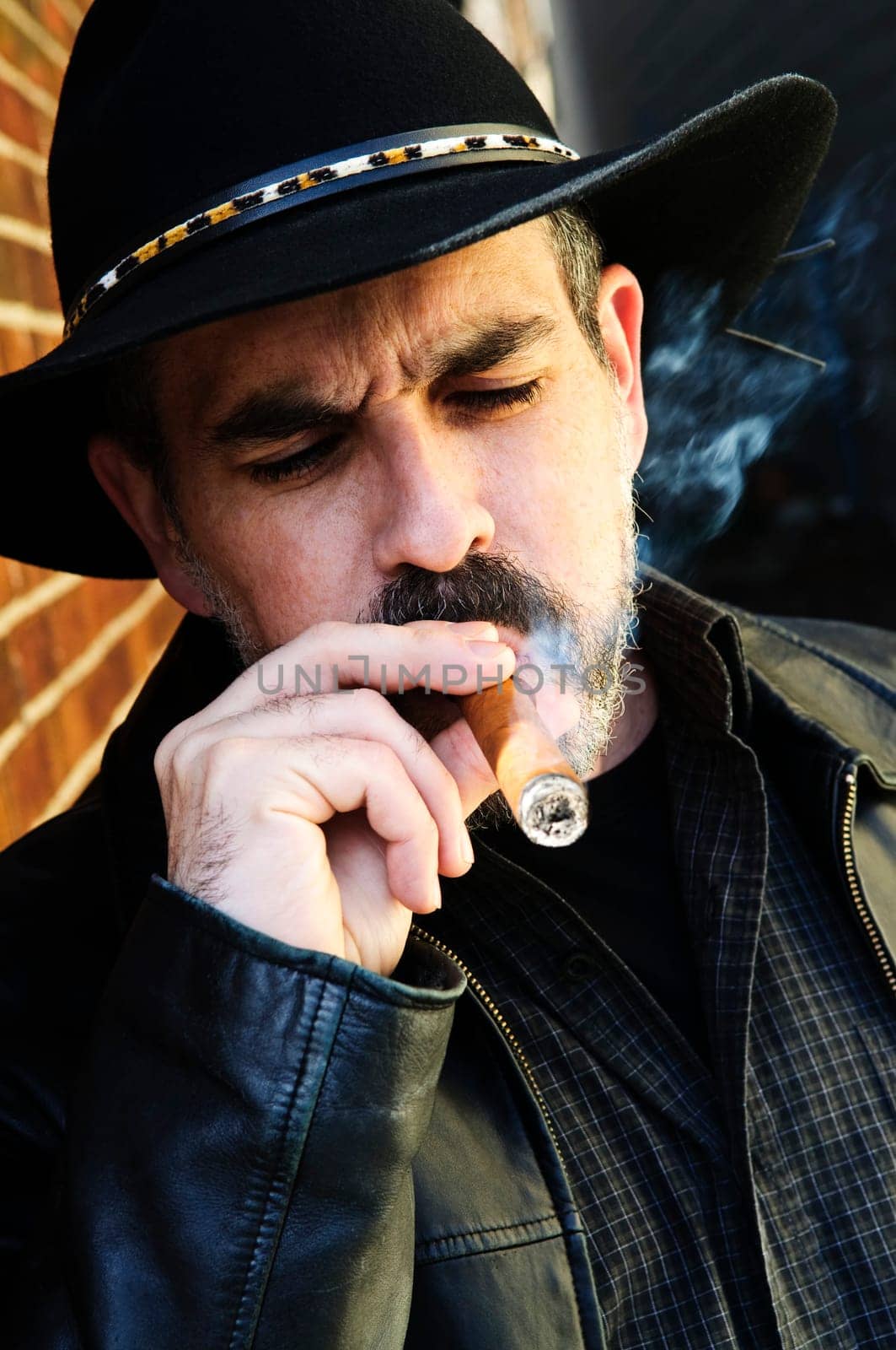 Bearded man smoking cigar