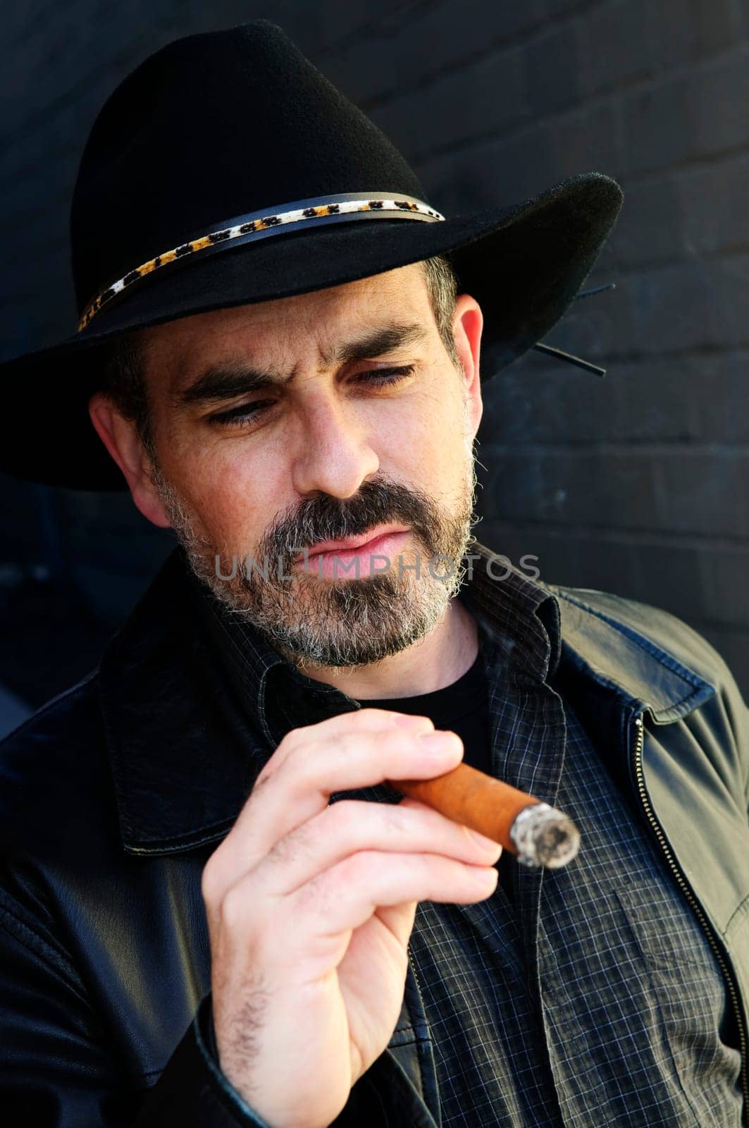 Bearded man smoking cigar