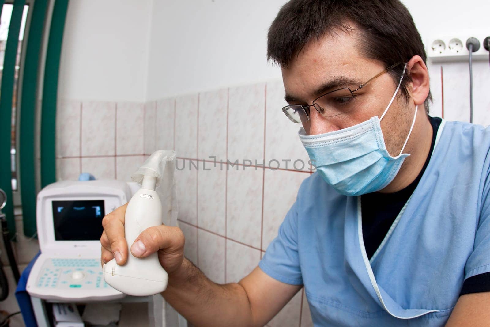Doctor looking at modern ultrasound de