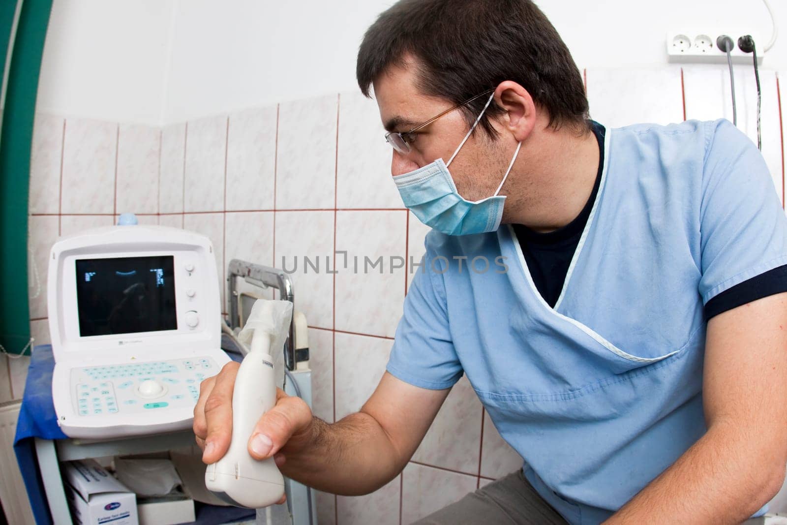 Doctor looking at modern ultrasound de