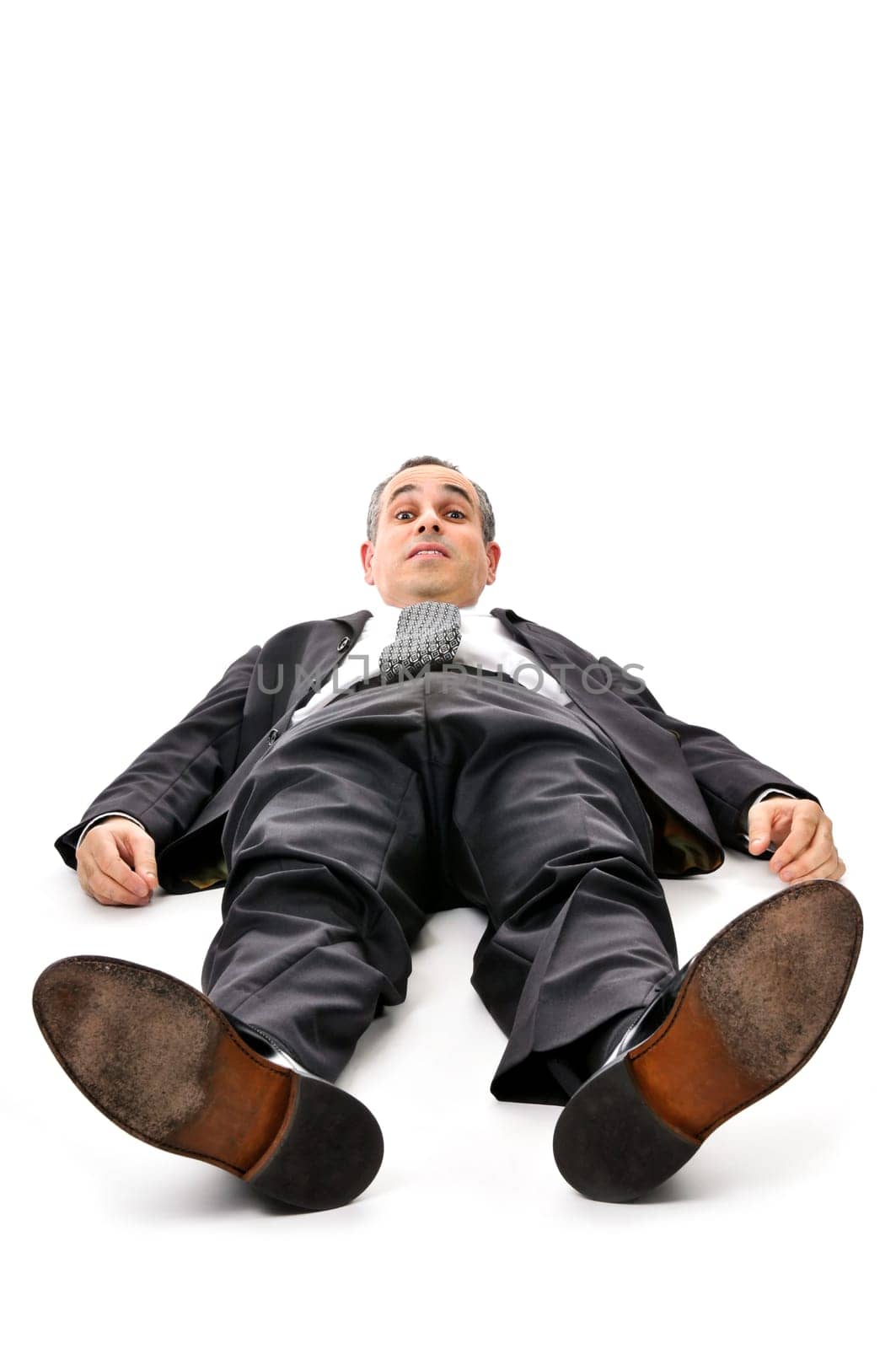 Businessman laying down on white backgro
