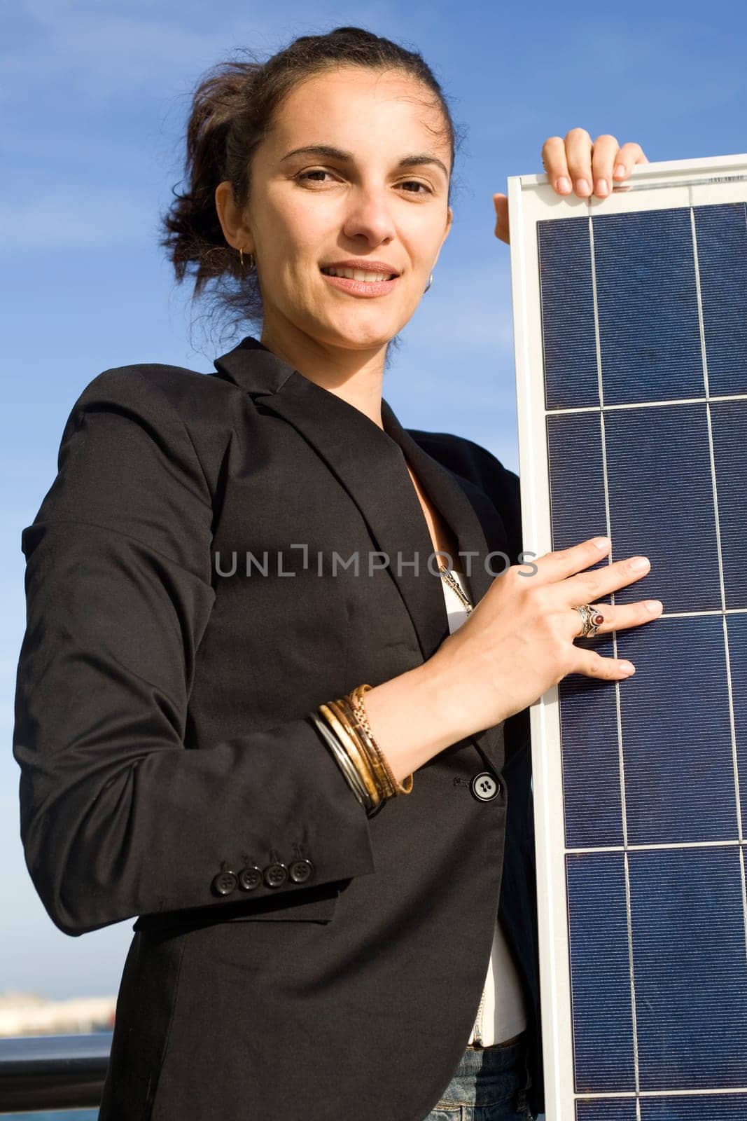 Woman holding a solar panel