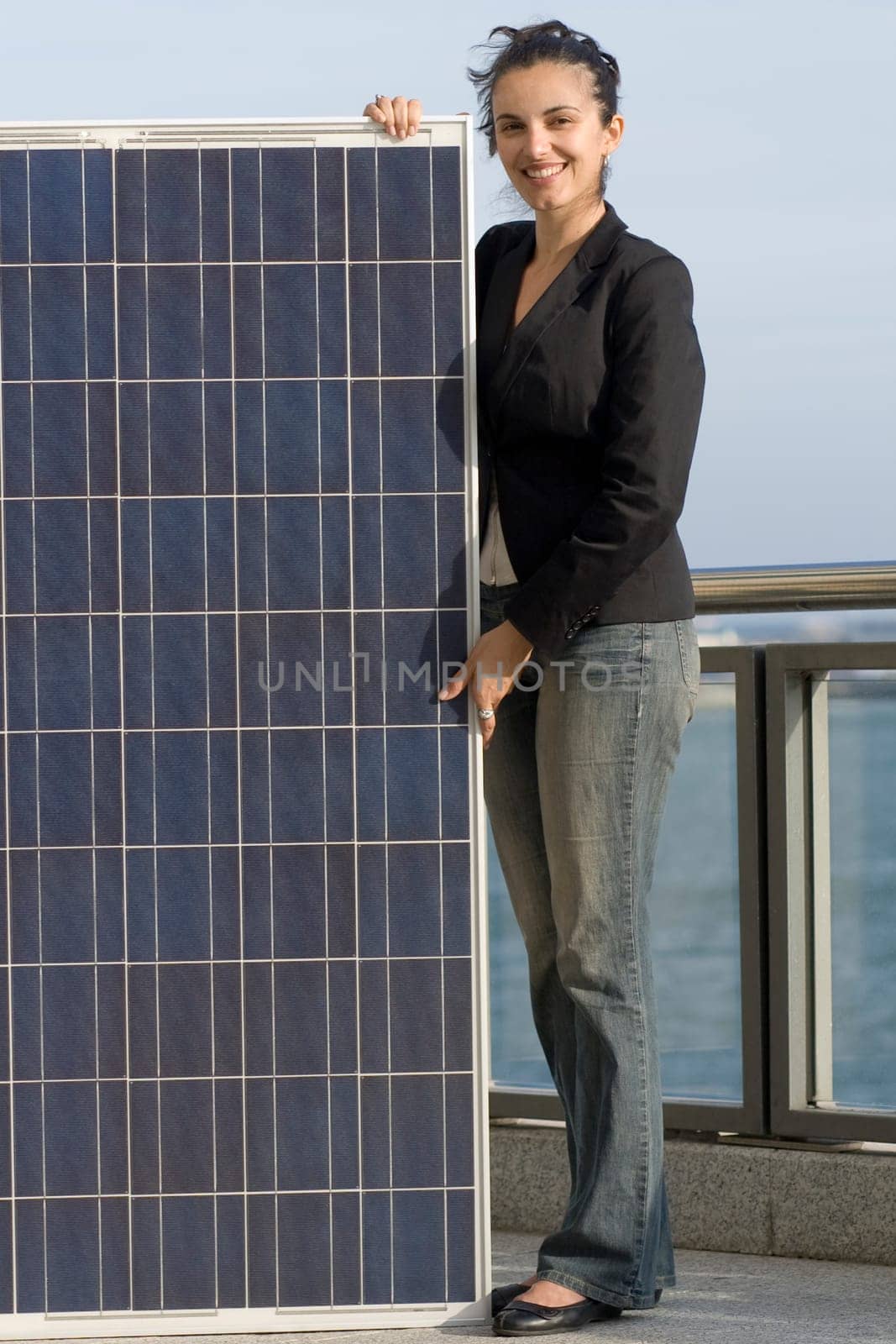 Woman holding a solar panel