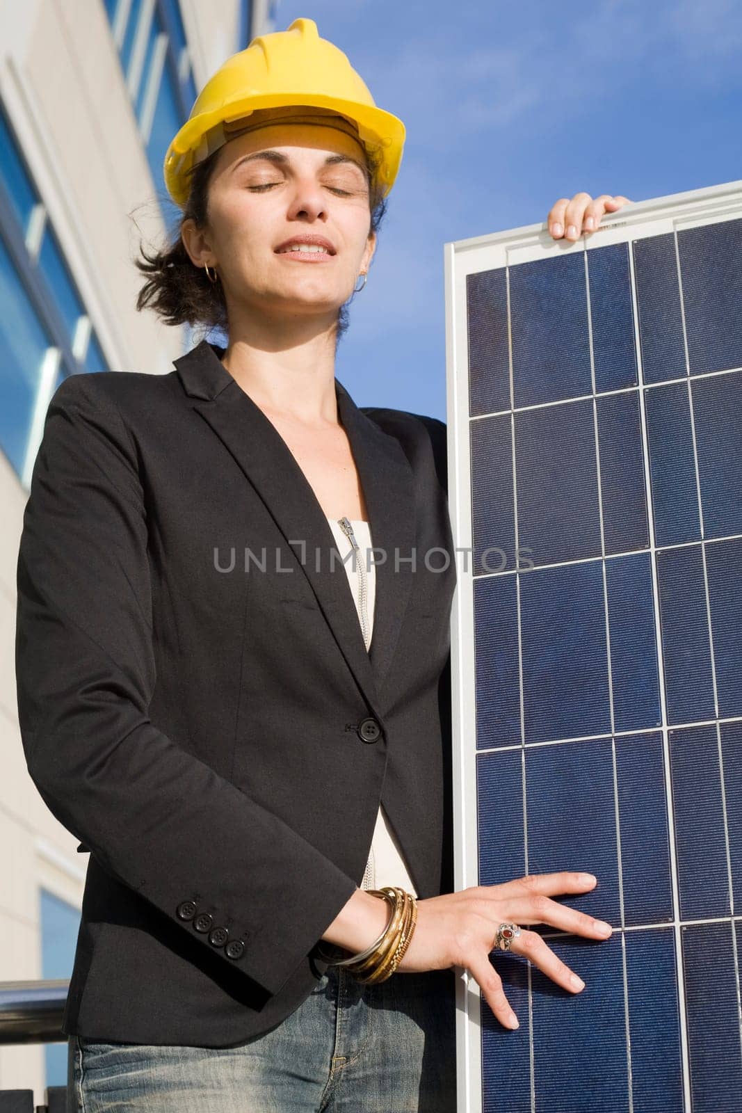 Woman holding a solar panel