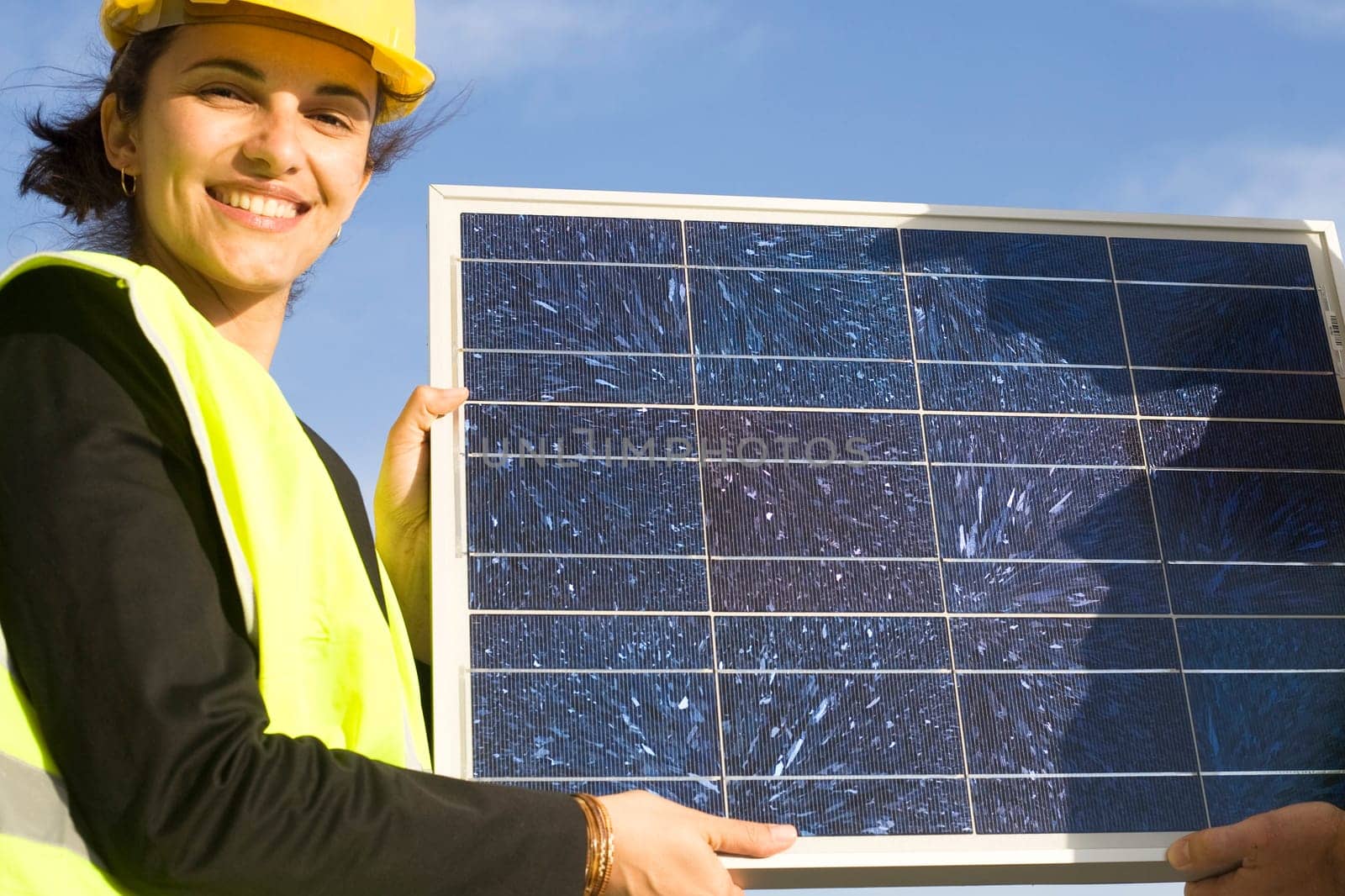 Woman holding a solar panel
