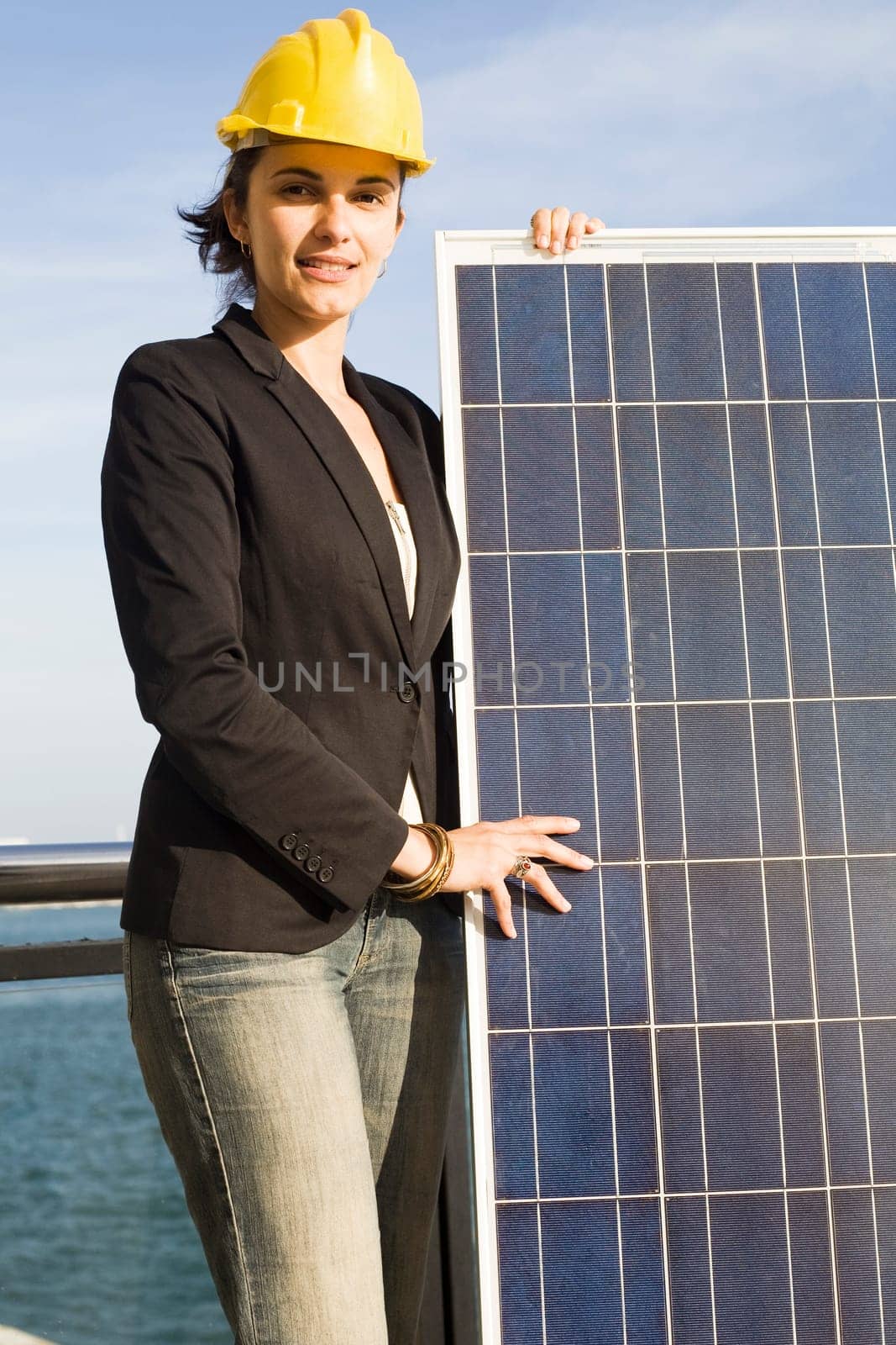 Woman holding a solar panel