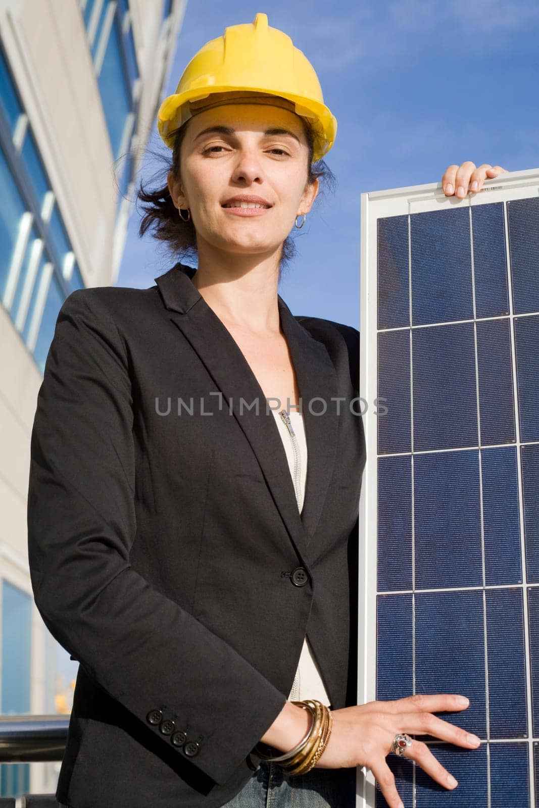 Woman holding a solar panel
