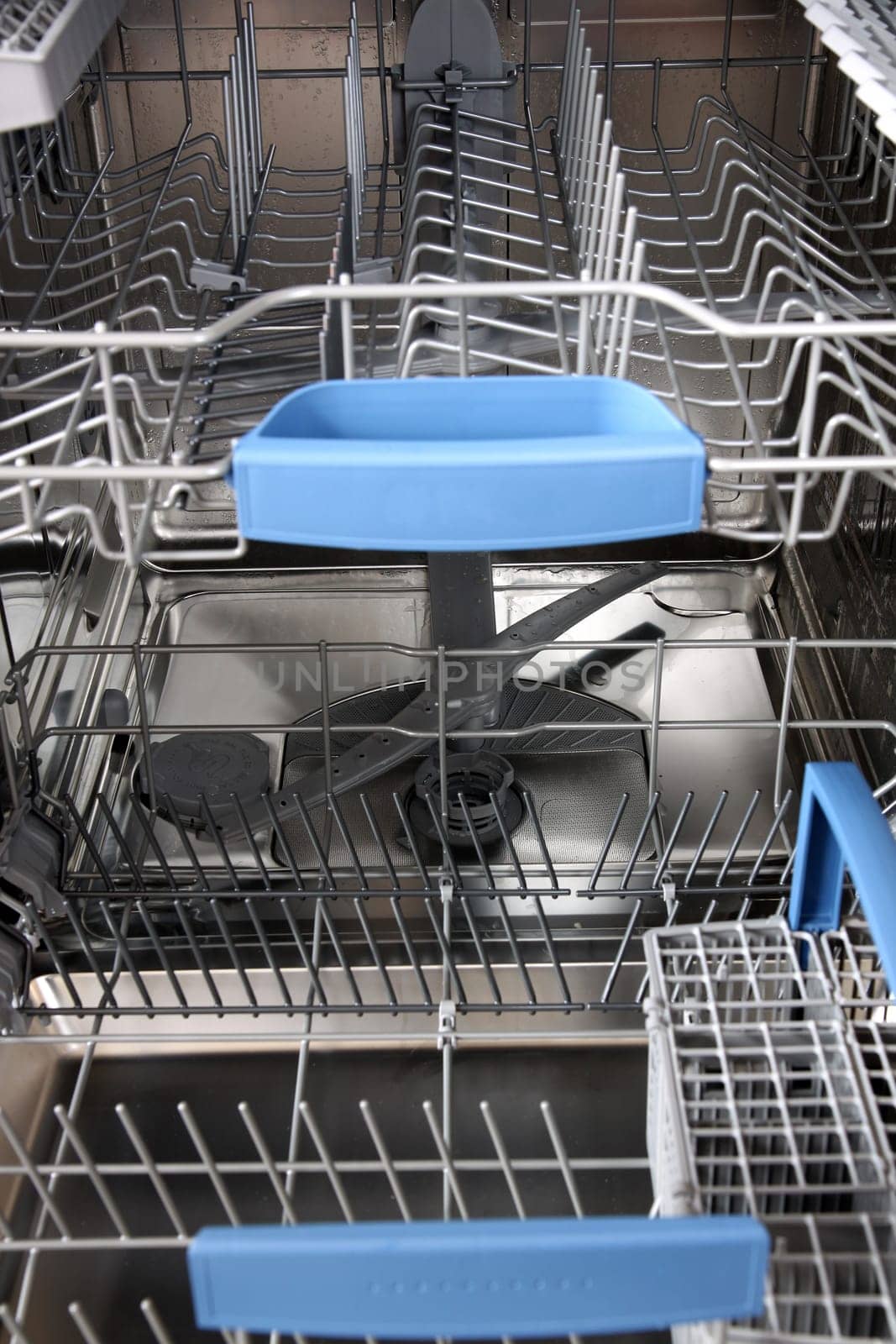 open dishwasher without dishes in kitchen