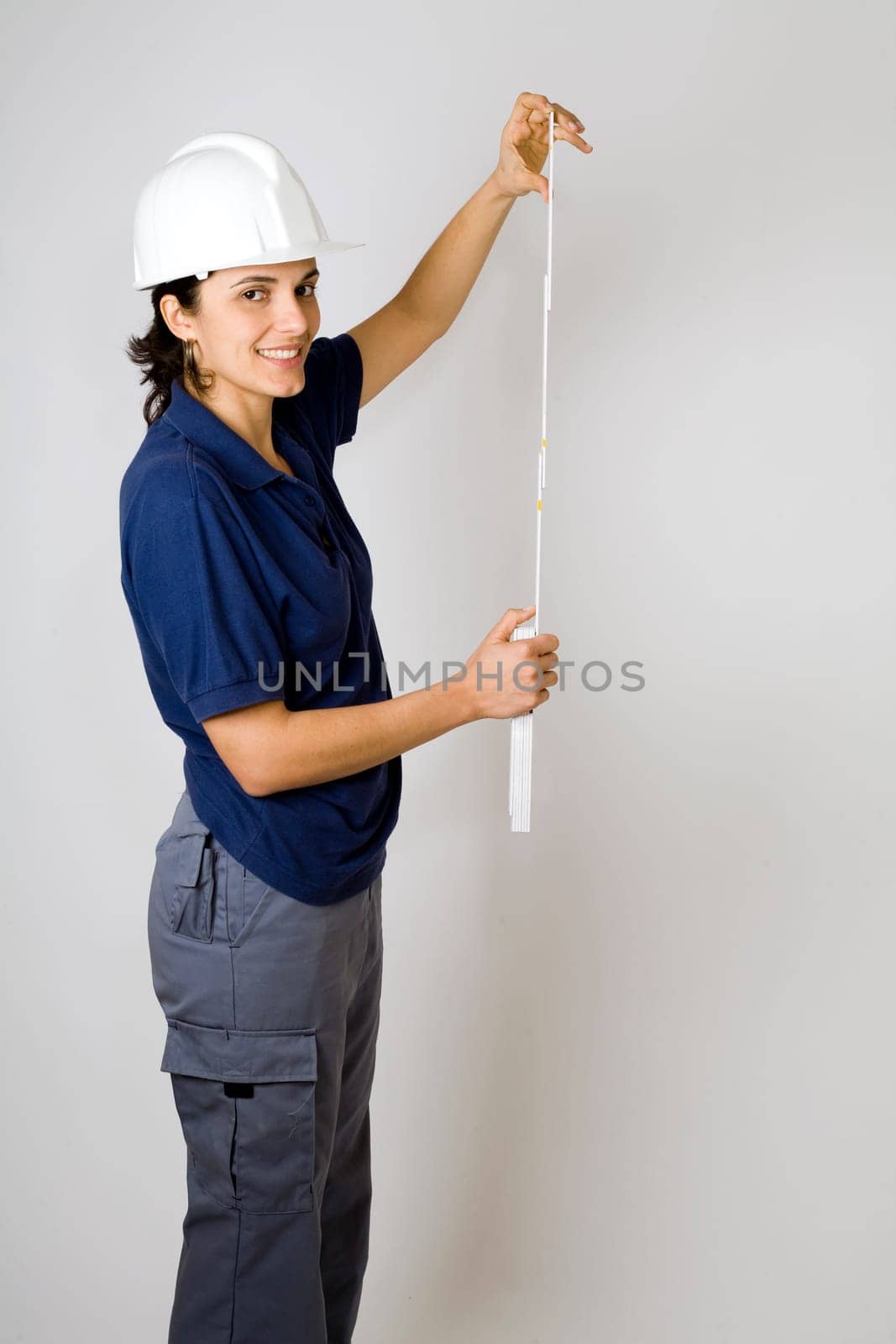 Female Engineer Measuring Folding Rule