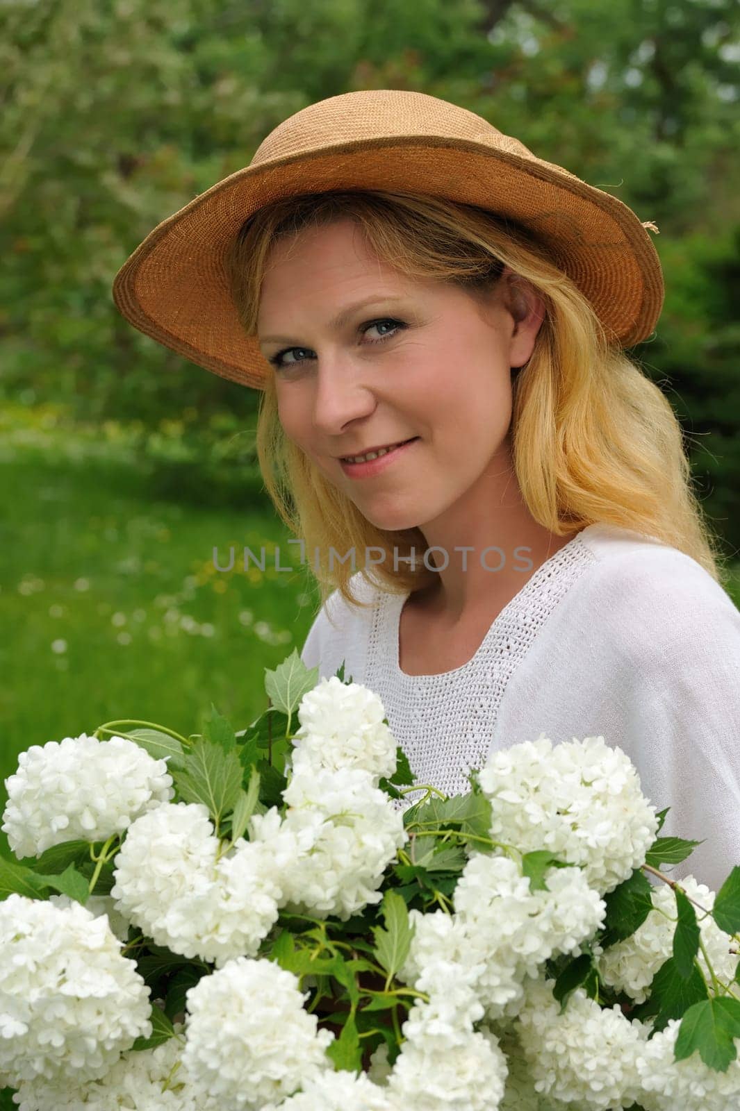 Young woman with snowballs