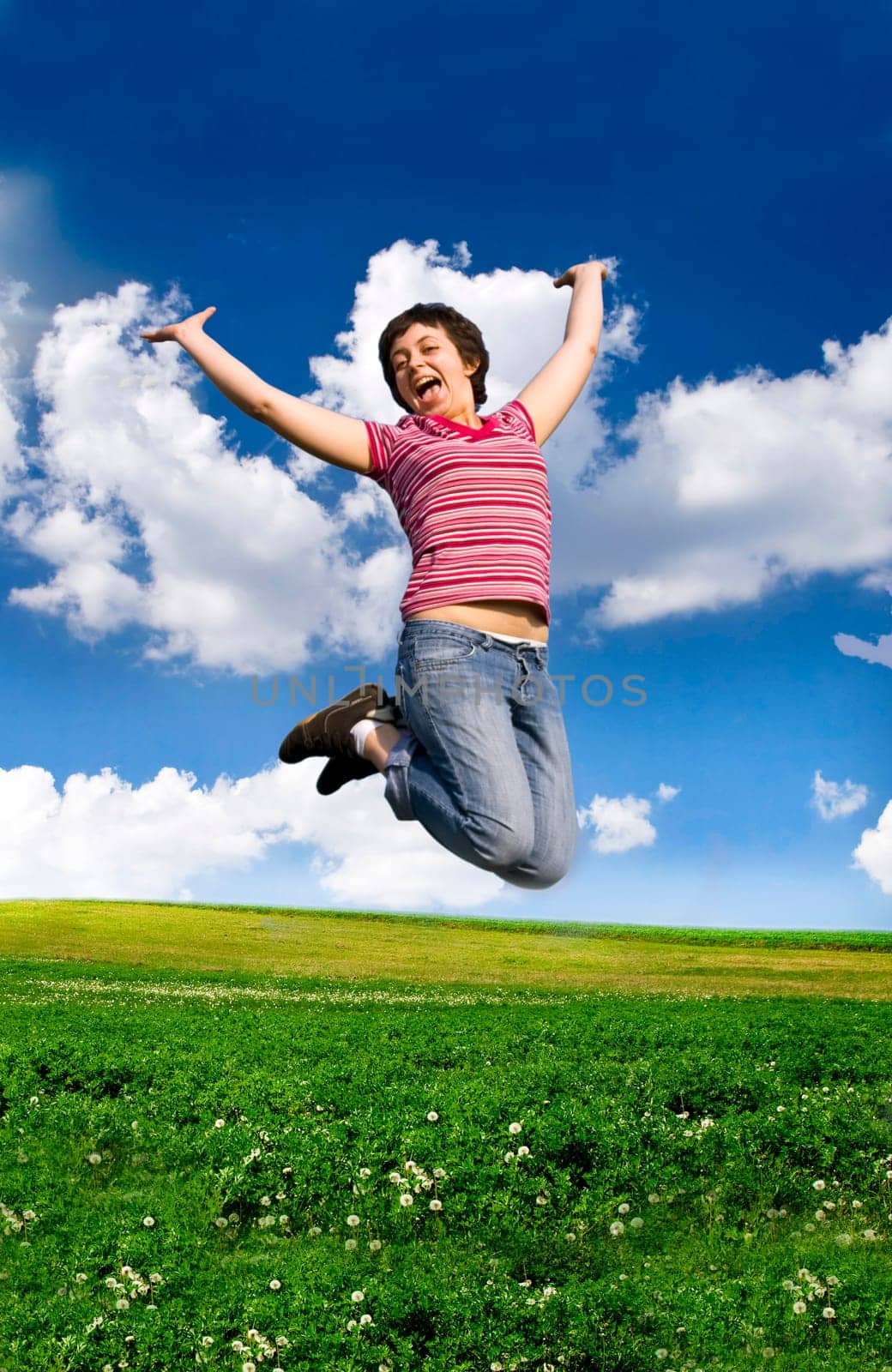 Young happy woman jumping high