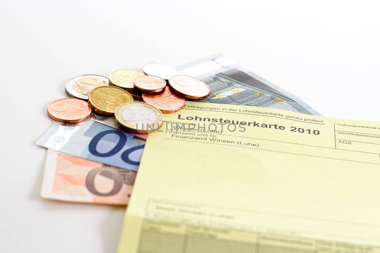 Income tax card 2010 with banknotes and euro coins