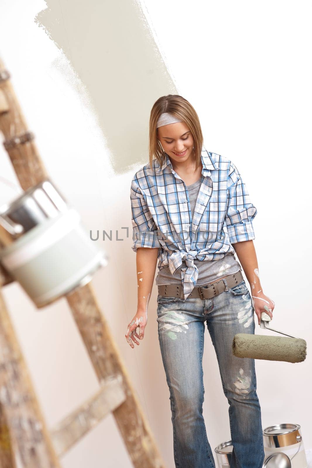 Home improvement Young woman with paint roller