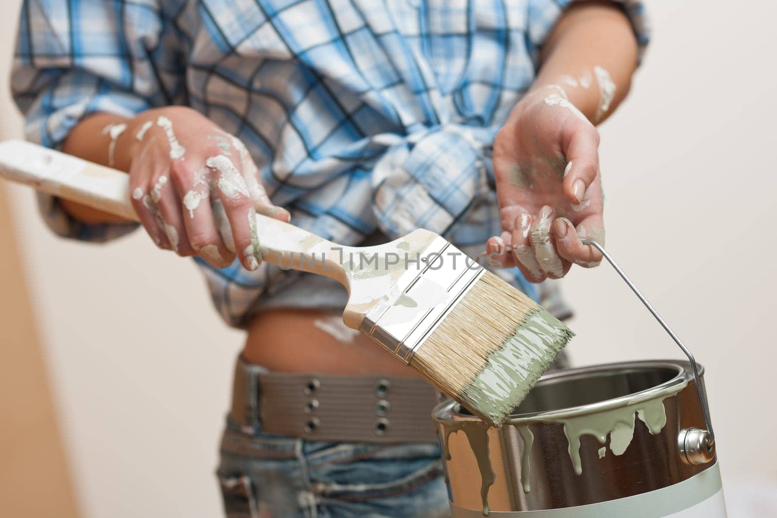 Home improvement Young woman with paint roller
