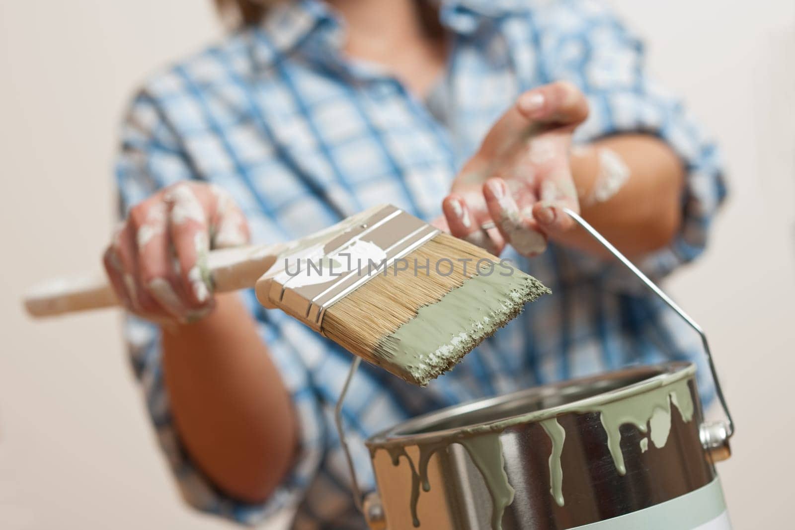 Home improvement Young woman with paint roller
