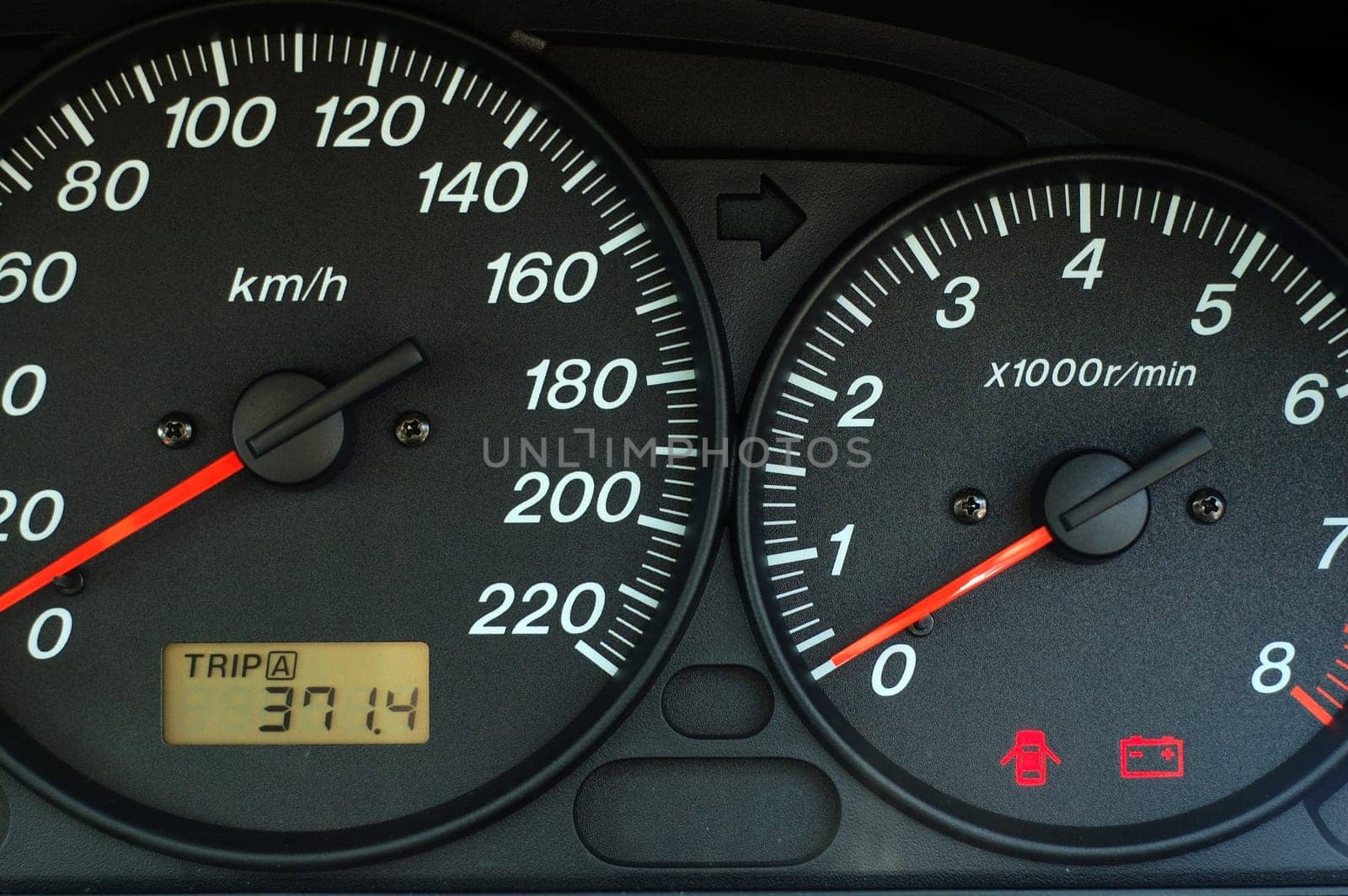 Car dashboard with speed and rpm dials
