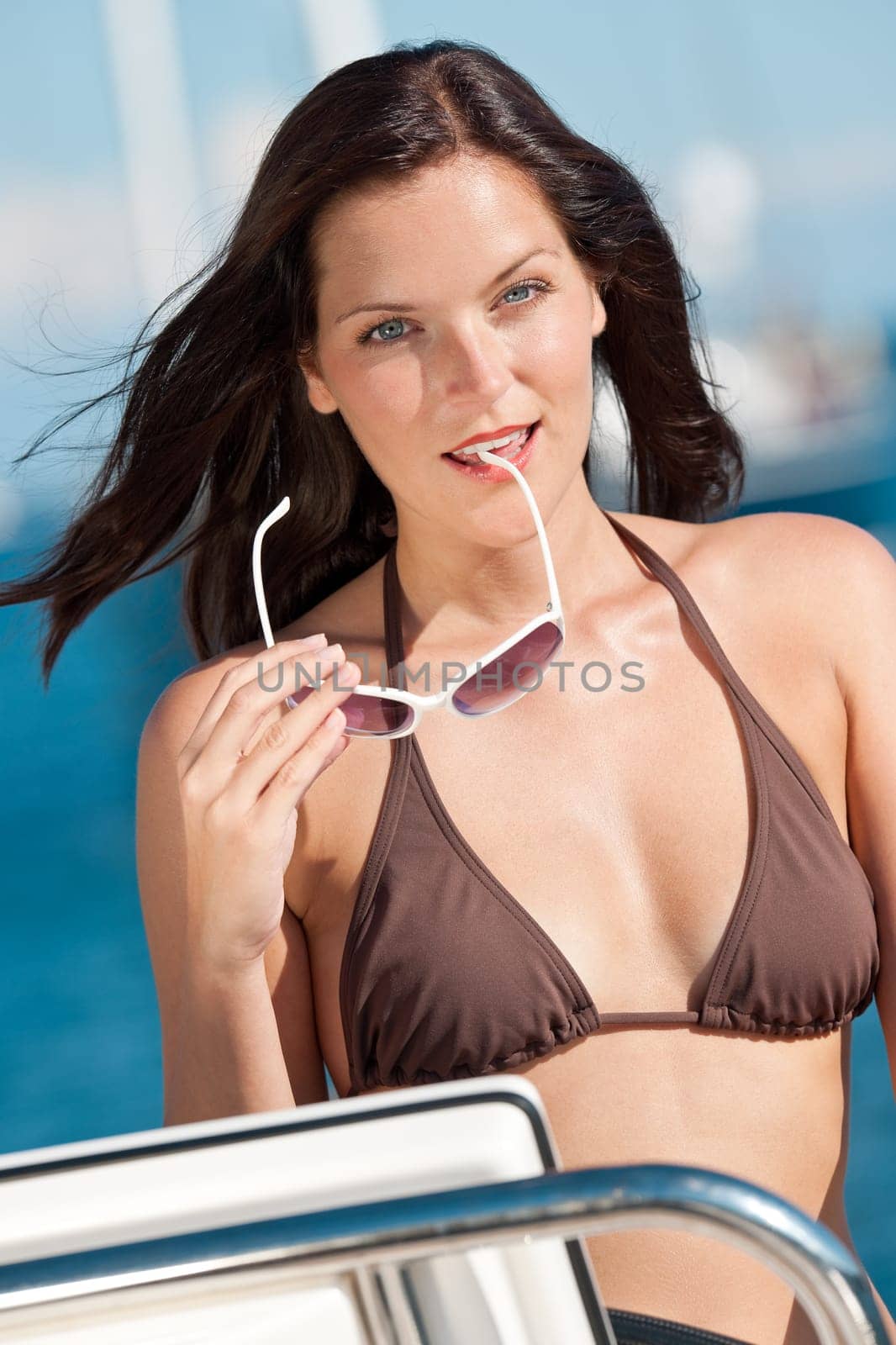Young woman sailing on yacht