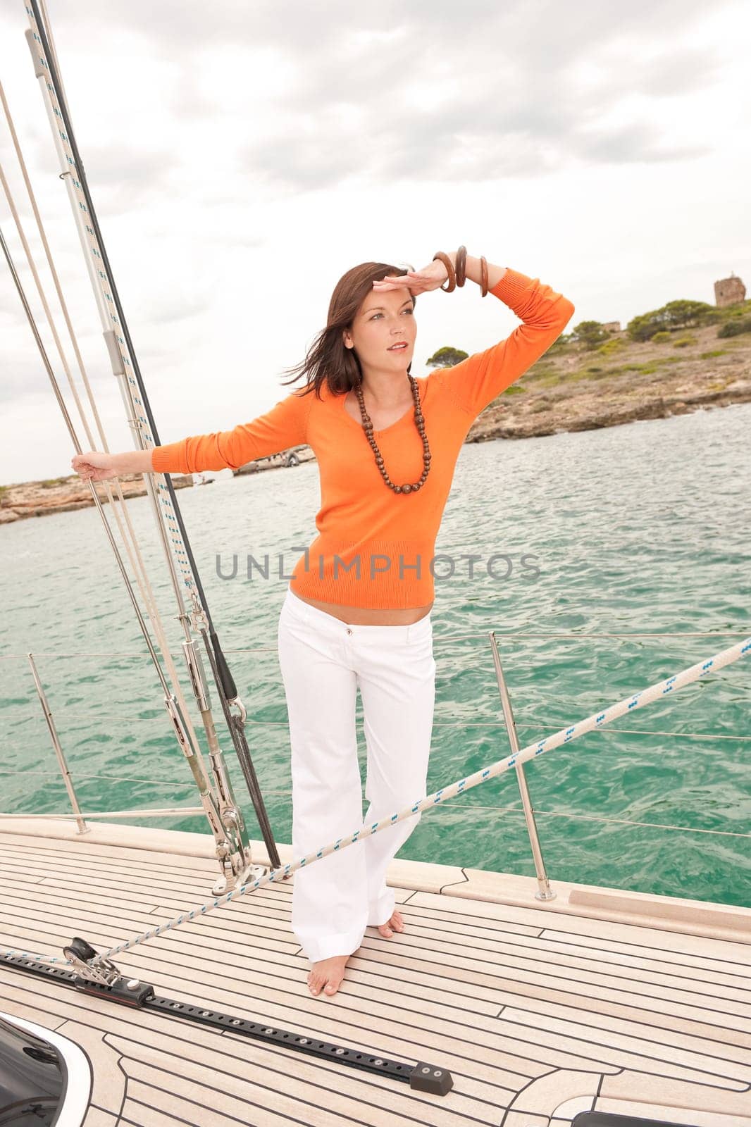 Young woman sailing on yacht