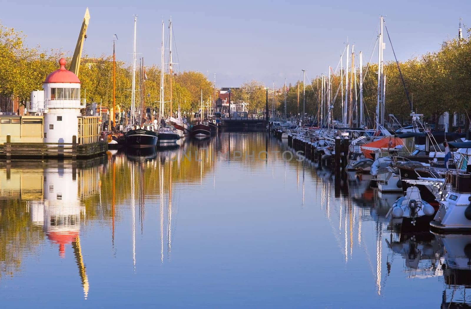 Harbour on autumn morning with blue sky