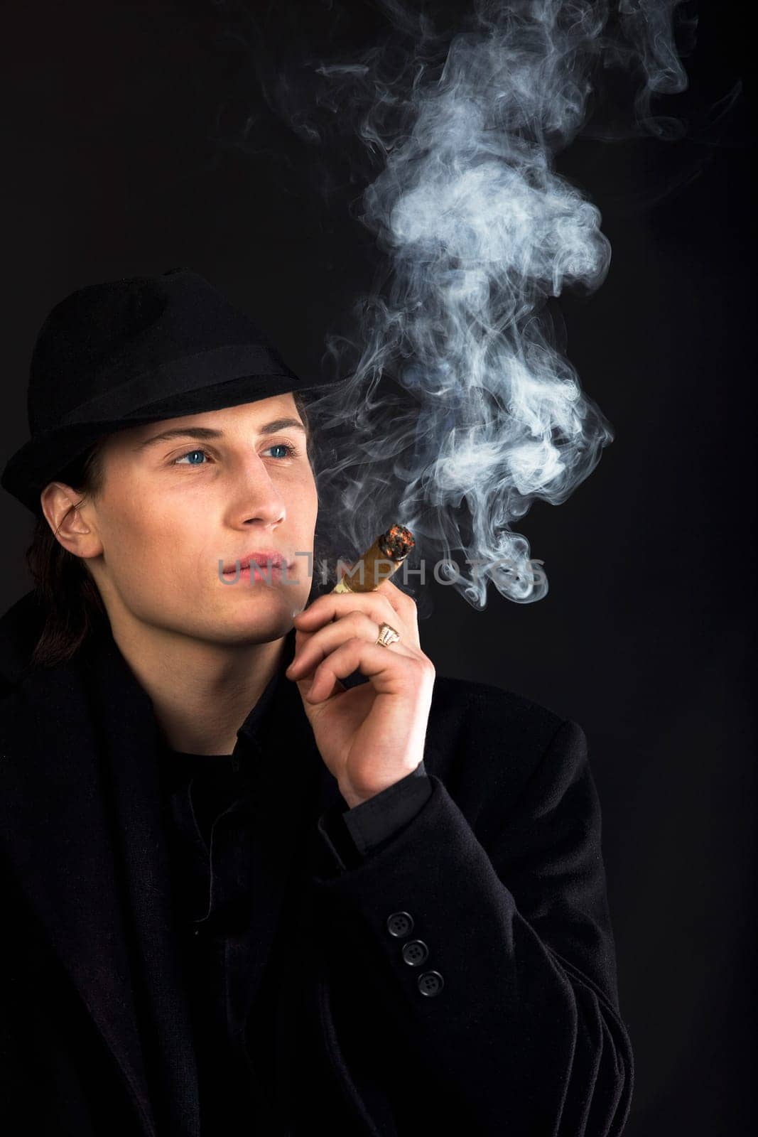 Man in black cloth think with serious look