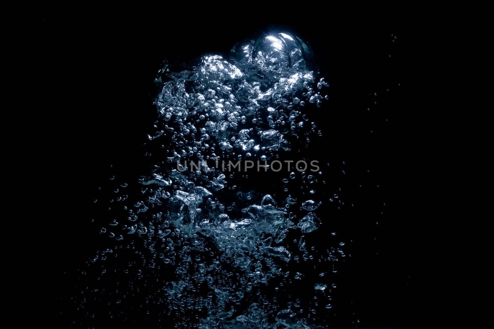 air bubbles rising over black