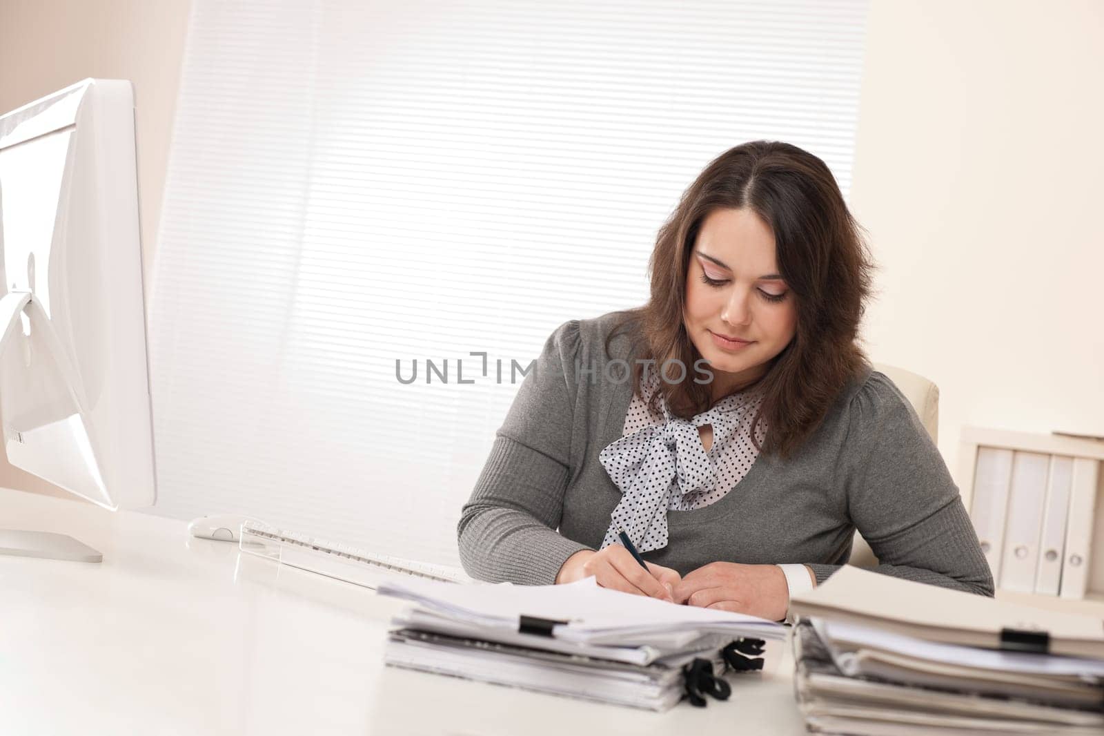Young businesswoman working at office