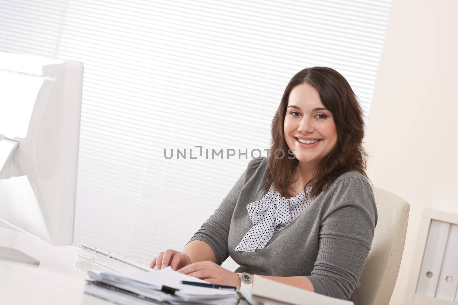 Young businesswoman working at office
