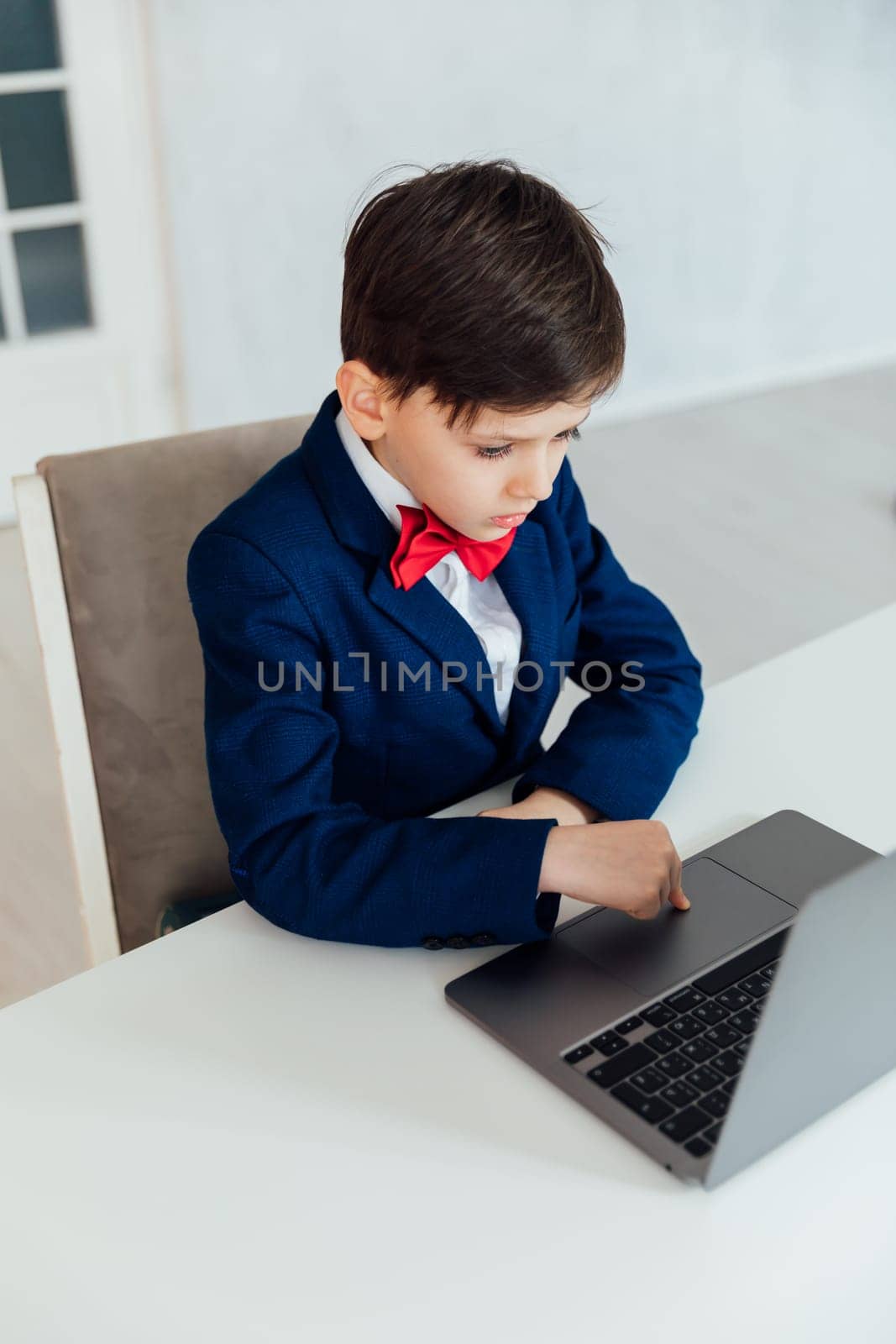 a student sits at a laptop at school education IT knowledge computer class