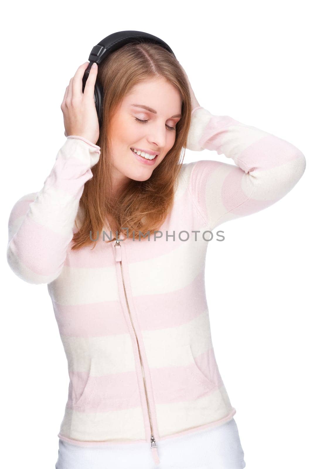 Young woman listens to music
