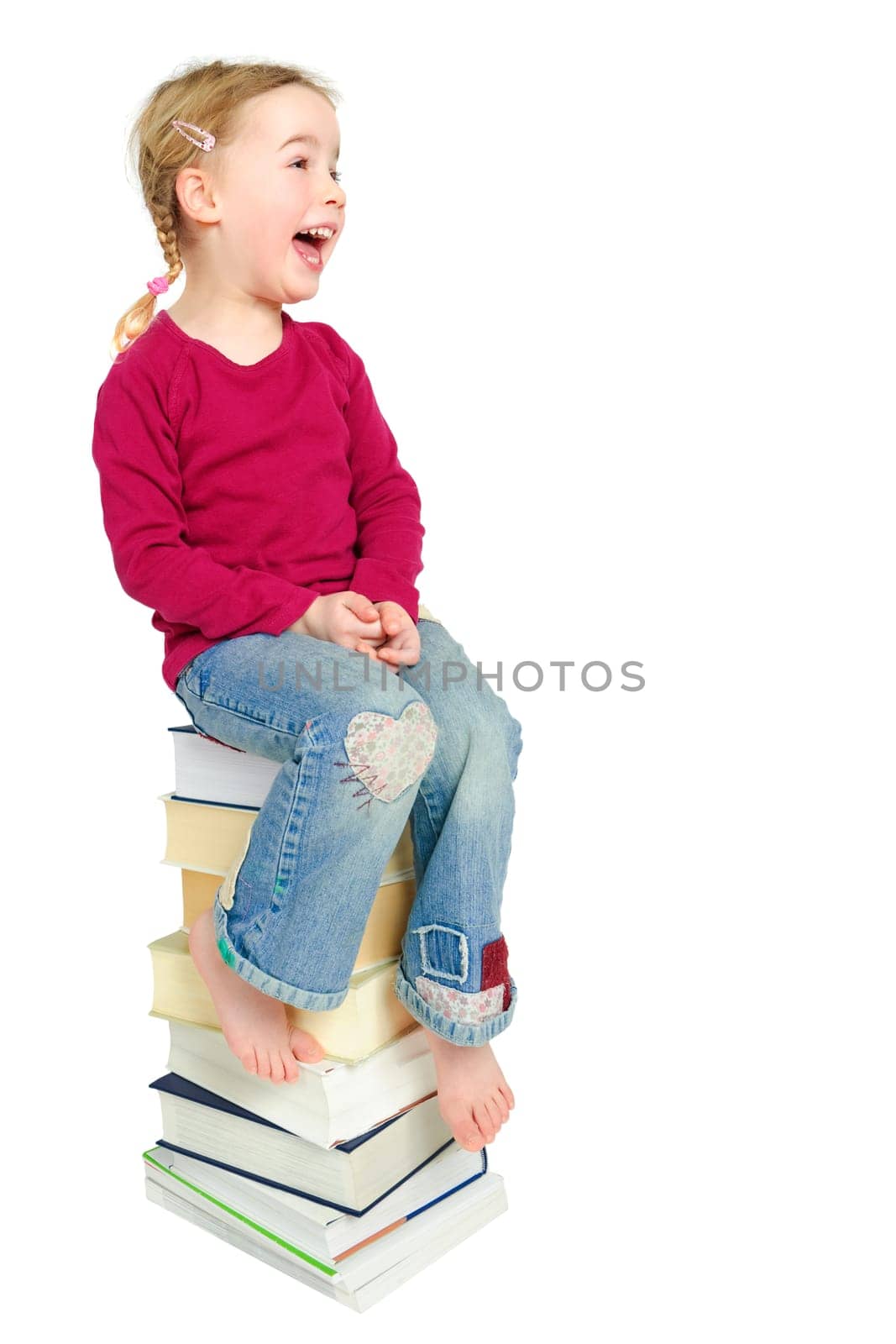 Child on a pile of books
