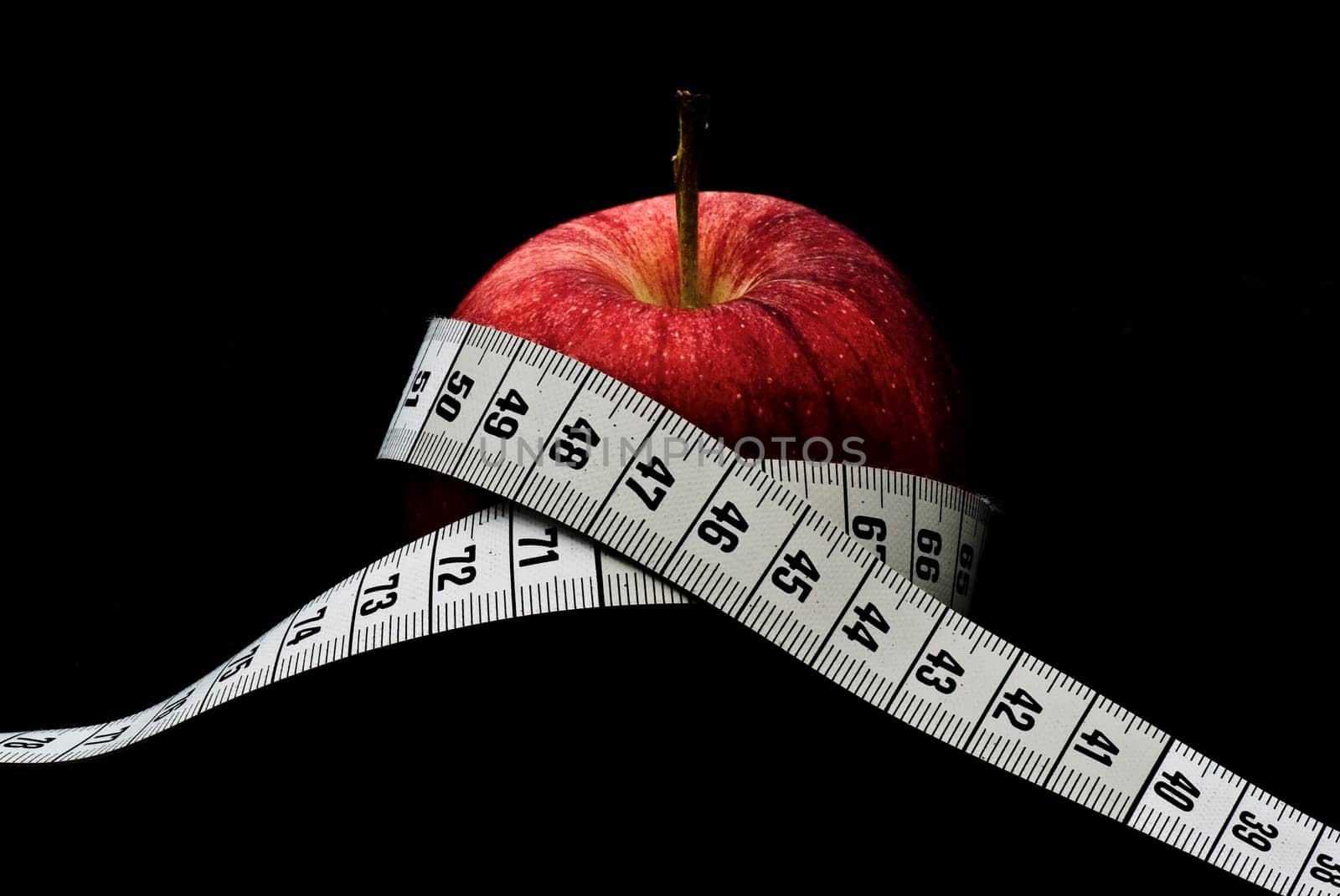 Apple with measuring tape