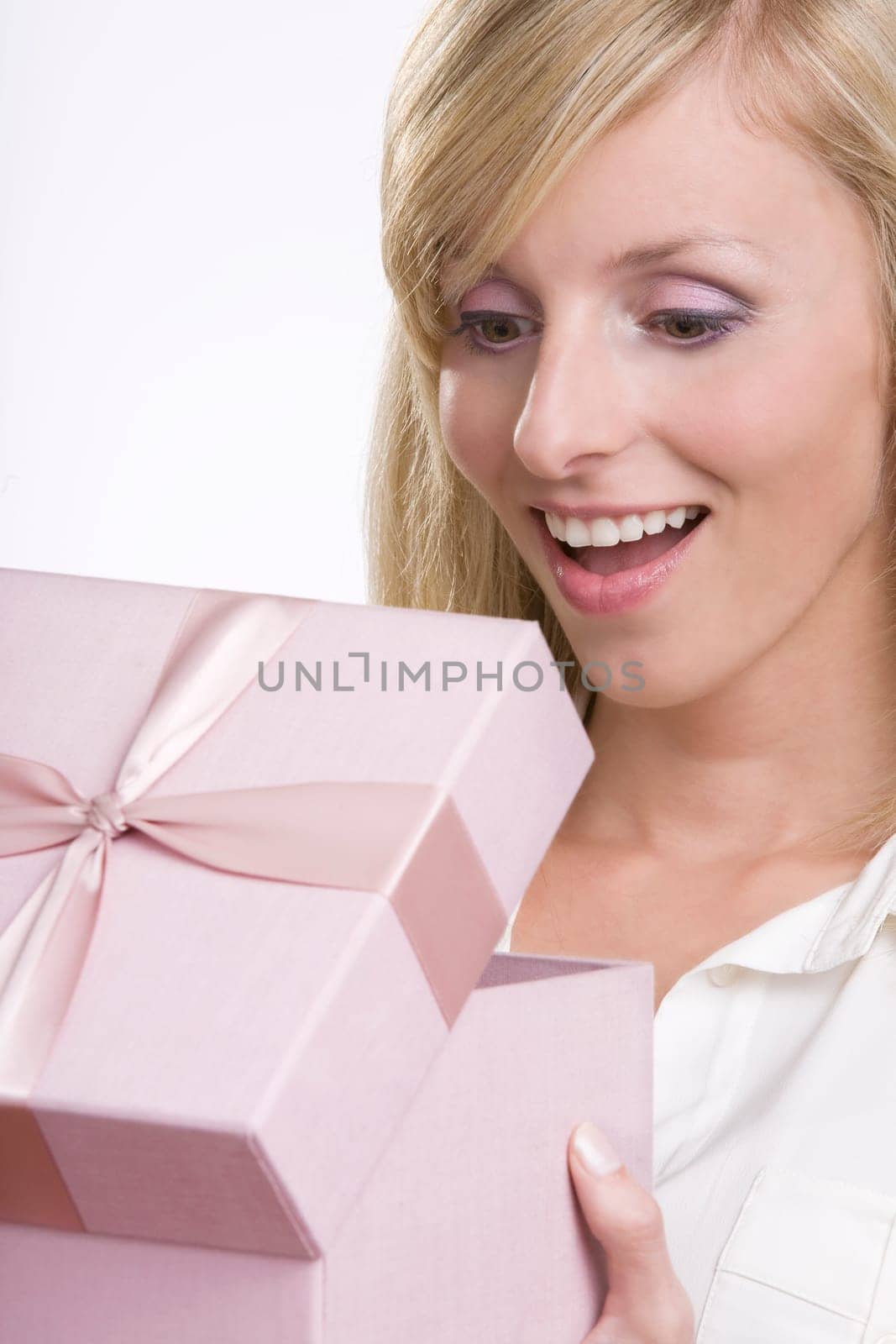 Beautiful woman opening a gift