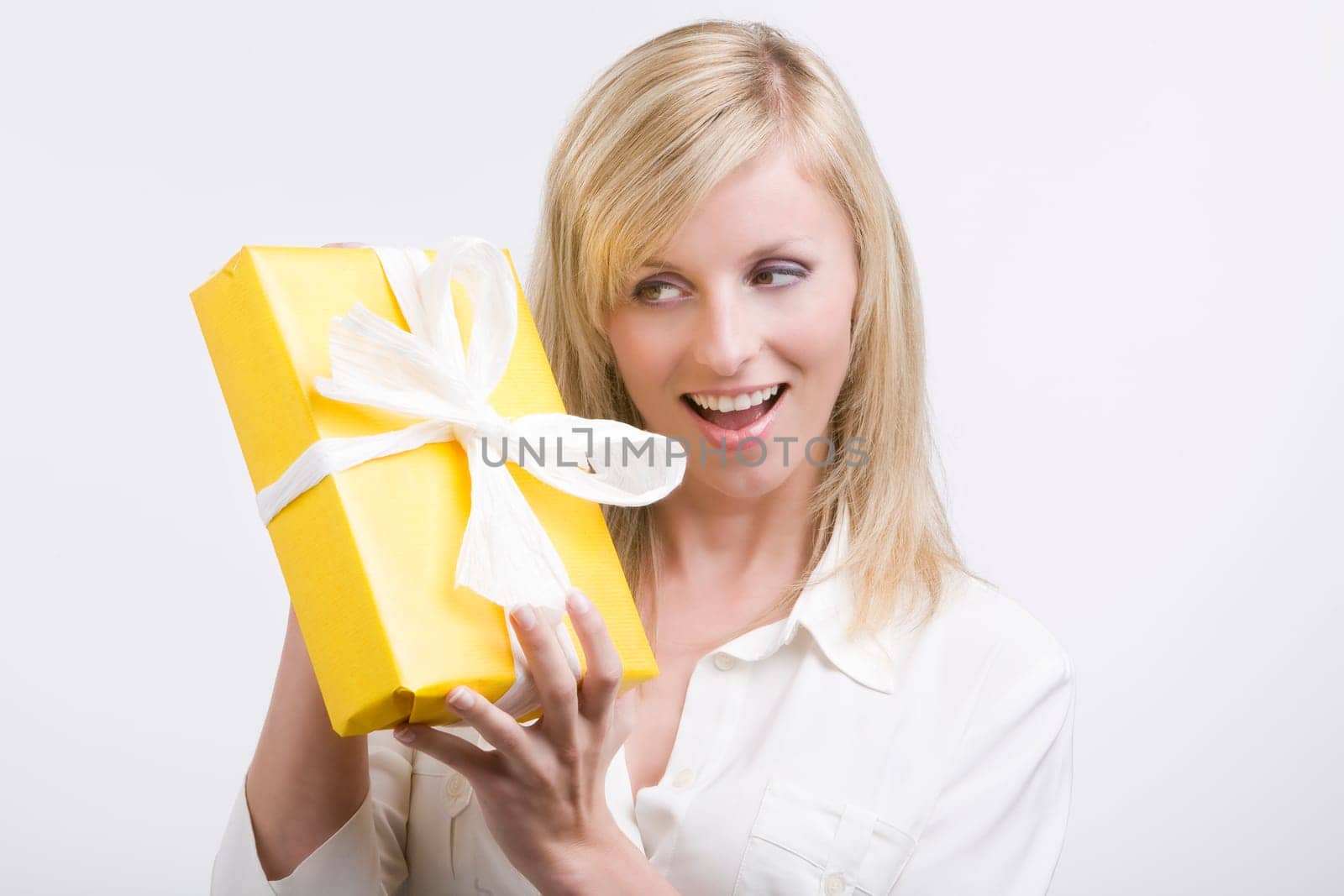 Beautiful business woman holding a gift