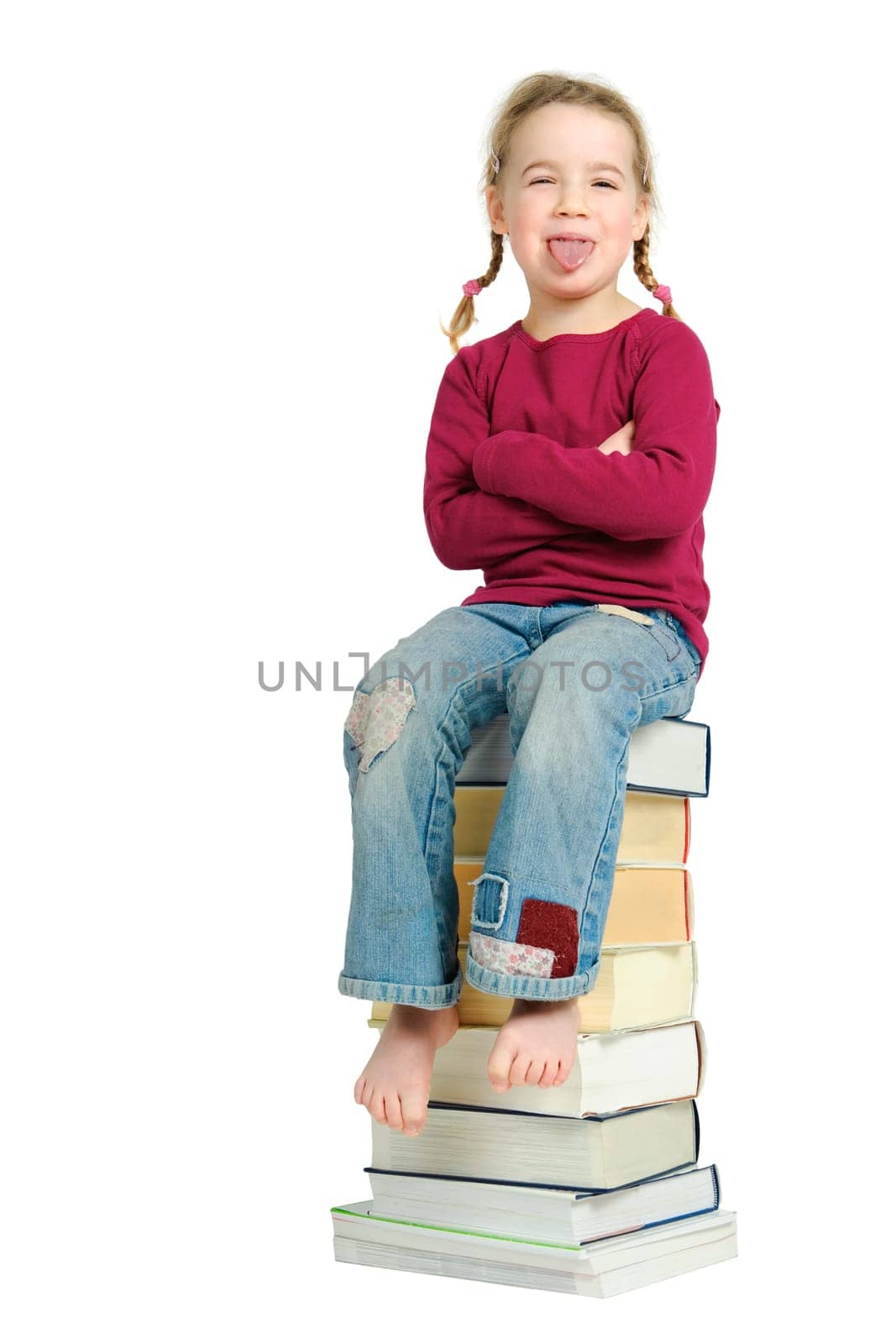 Child on a pile of books