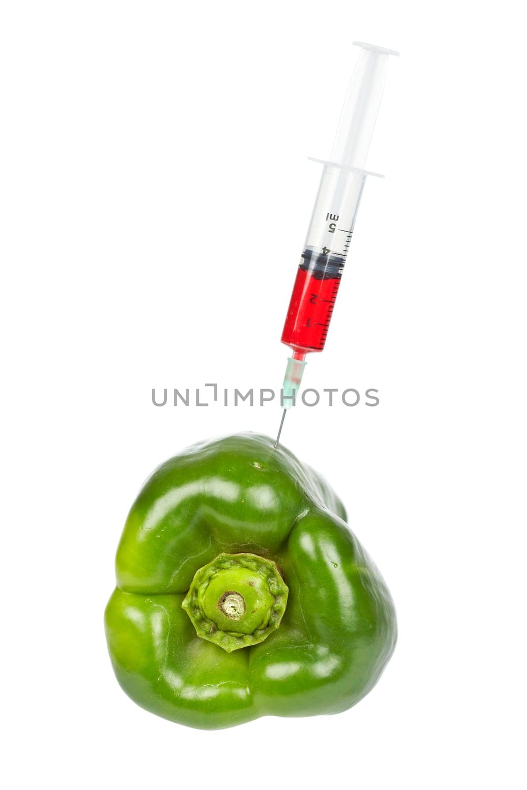 Green pepper with syringe inserted