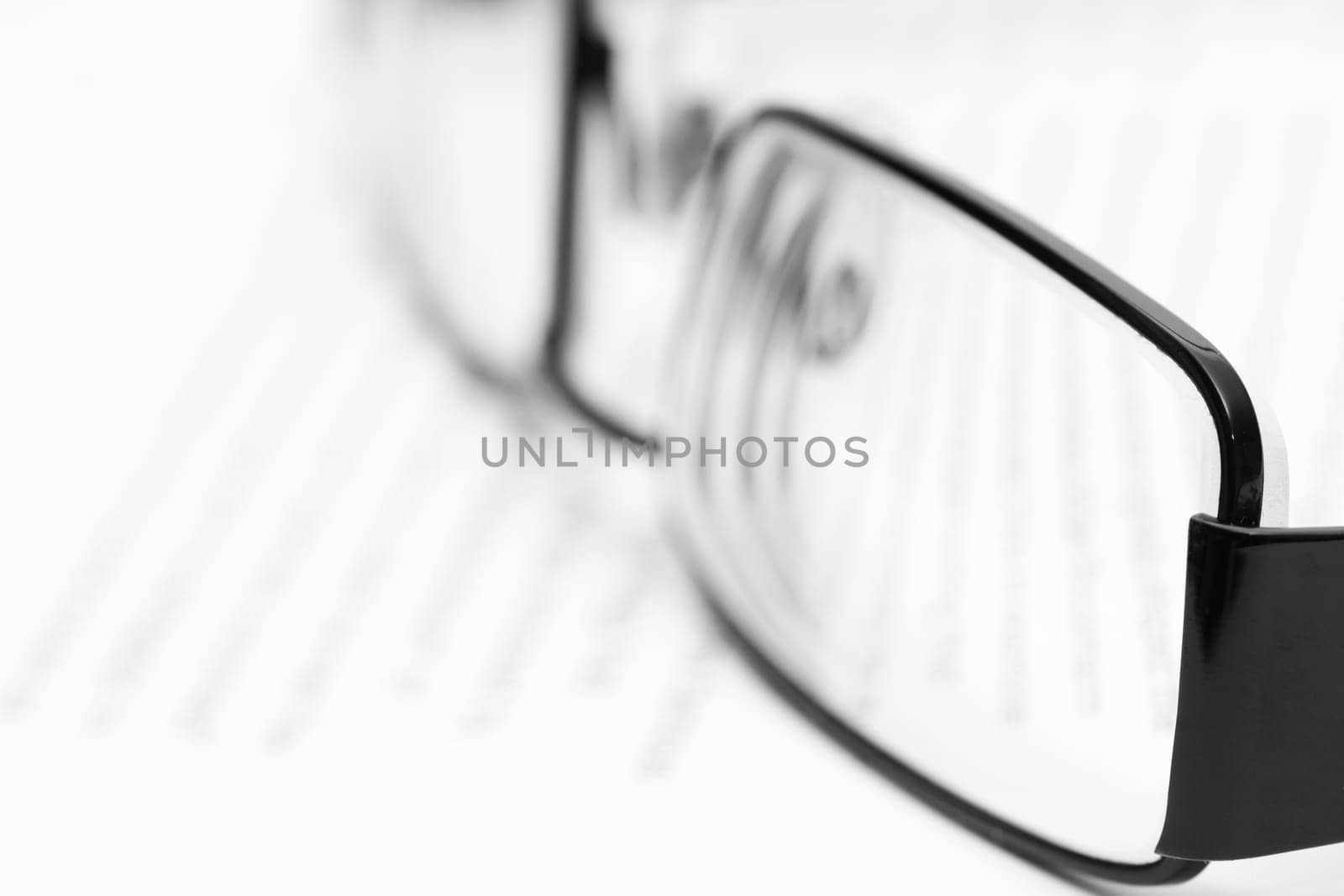 Eyeglasses on open book