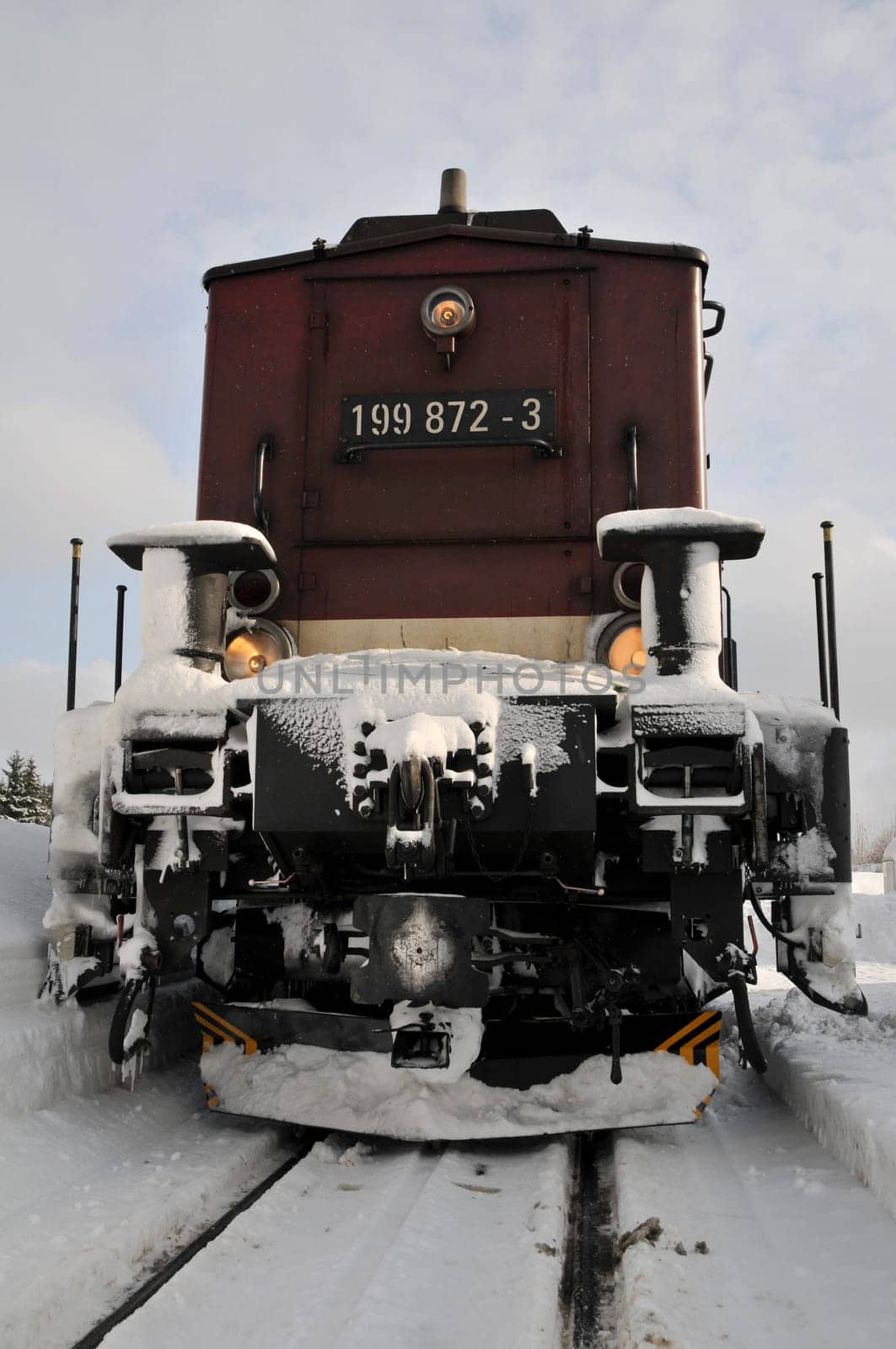 Diesel locomotive of the Harz Narrow Gauge Railway. Behind the locomotive is a snow blower.