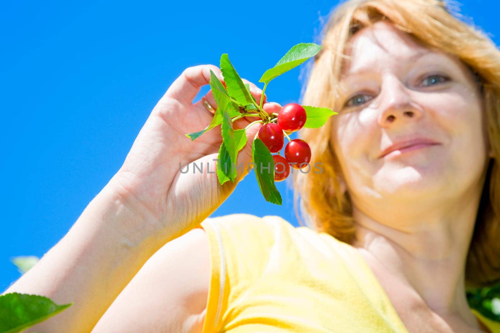 Woman with cherries