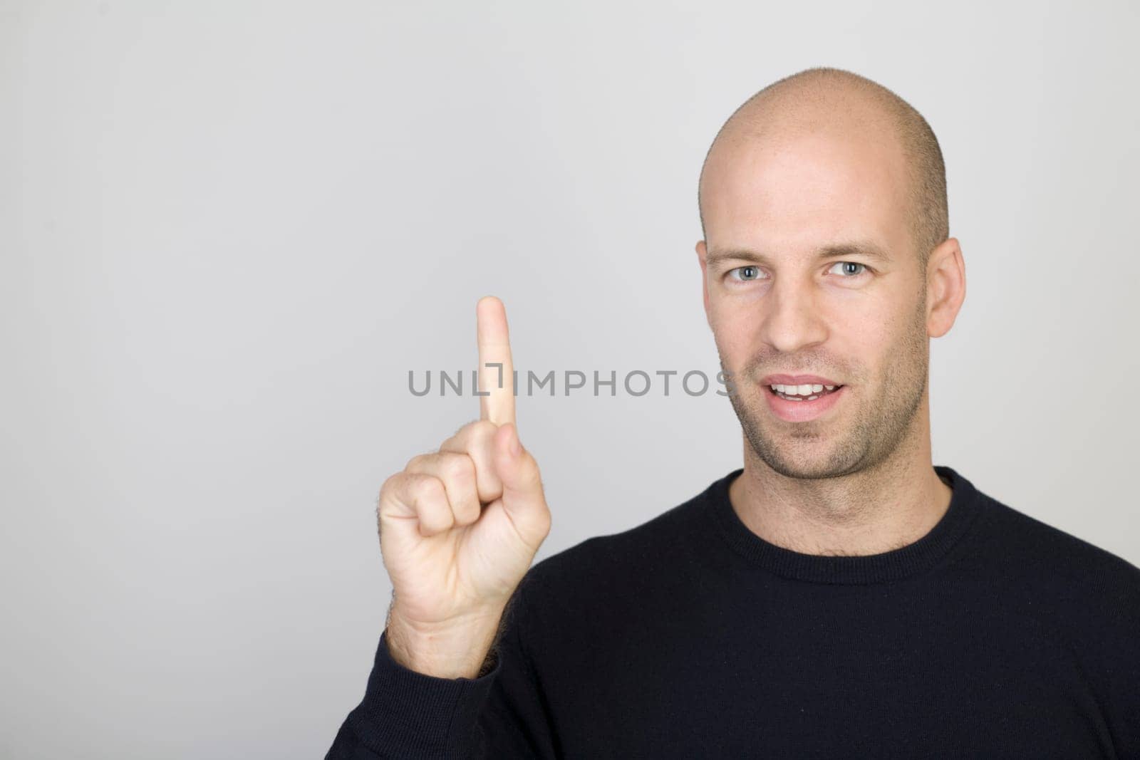 Man showing the number 1 with one finger