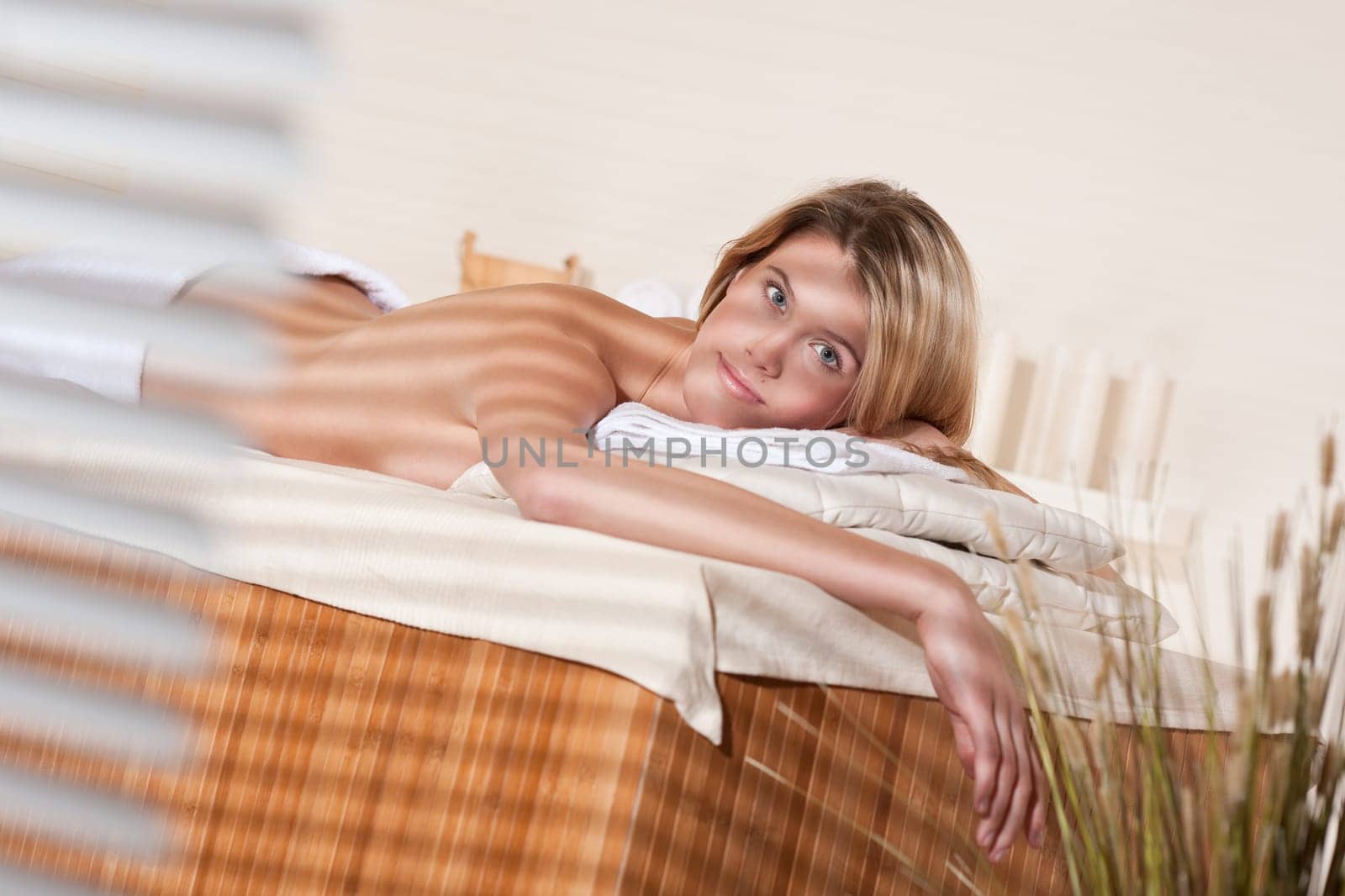 Spa - Young female client at wellness massage